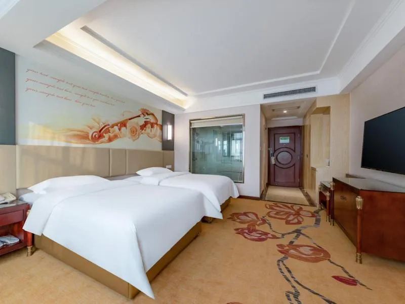 Bed in Vienna Hotel Shenzhen Songgang Shajiang Road