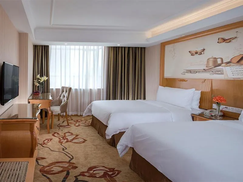 Bed in Vienna Hotel Shenzhen Shajing Shangnan