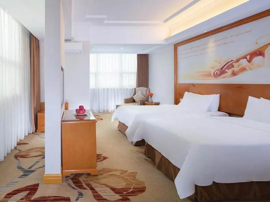 Bed in Vienna Hotel Dongguan Mayong Centre Avenue