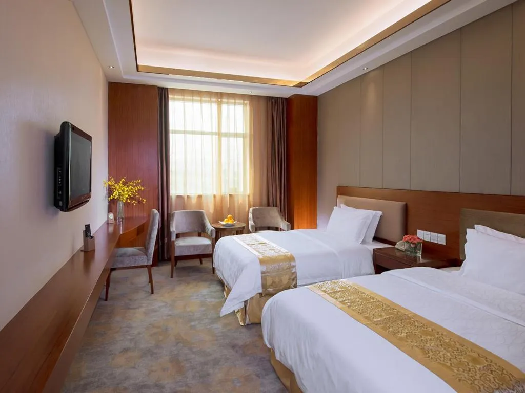Bed in Vienna Hotel Dongguan Tangxia Guanlan Lake Golf Club