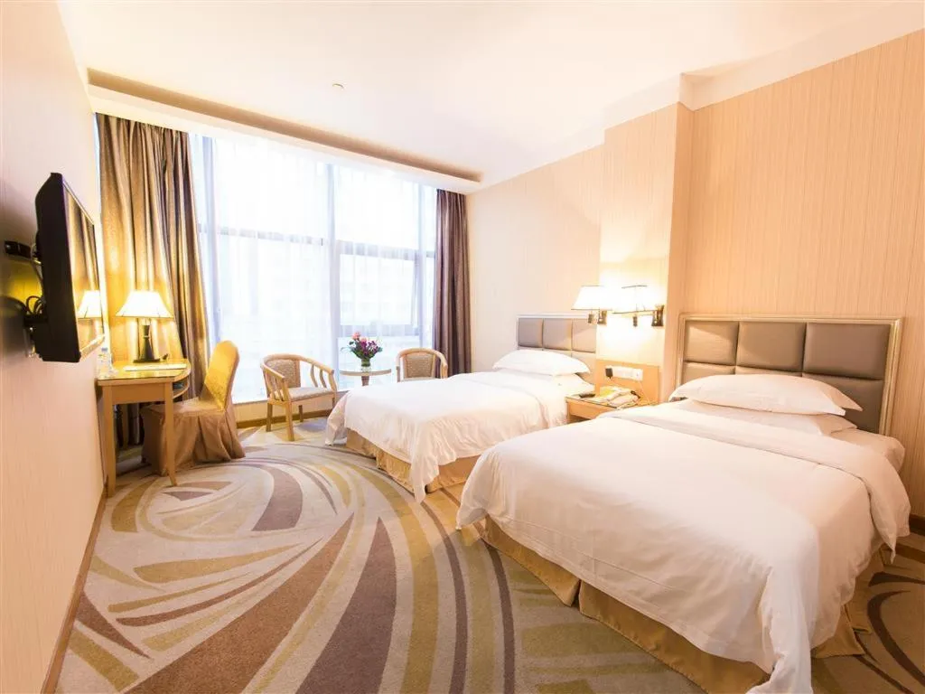 Bed in Vienna Hotel Zhanjiang Coast Avenue