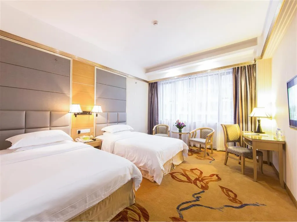 Bed in Vienna Hotel Zhanjiang Coast Avenue