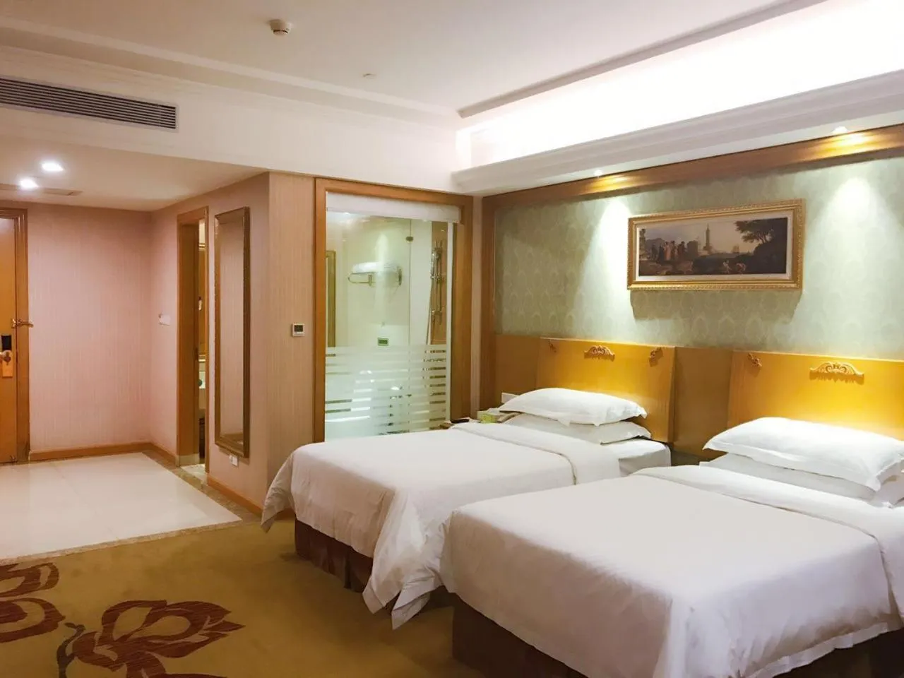 Bed in Vienna Hotel Foshan Nanzhuang Avenue