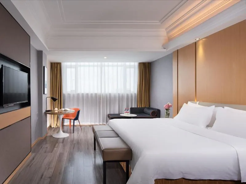 Bed in Vienna International Hotel Zhongshan Shiqi Kanghua Road