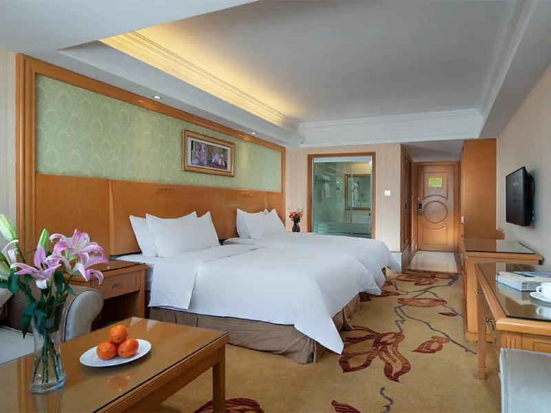 Bed in Vienna International Hotel Lijiang Yuxue Avenue