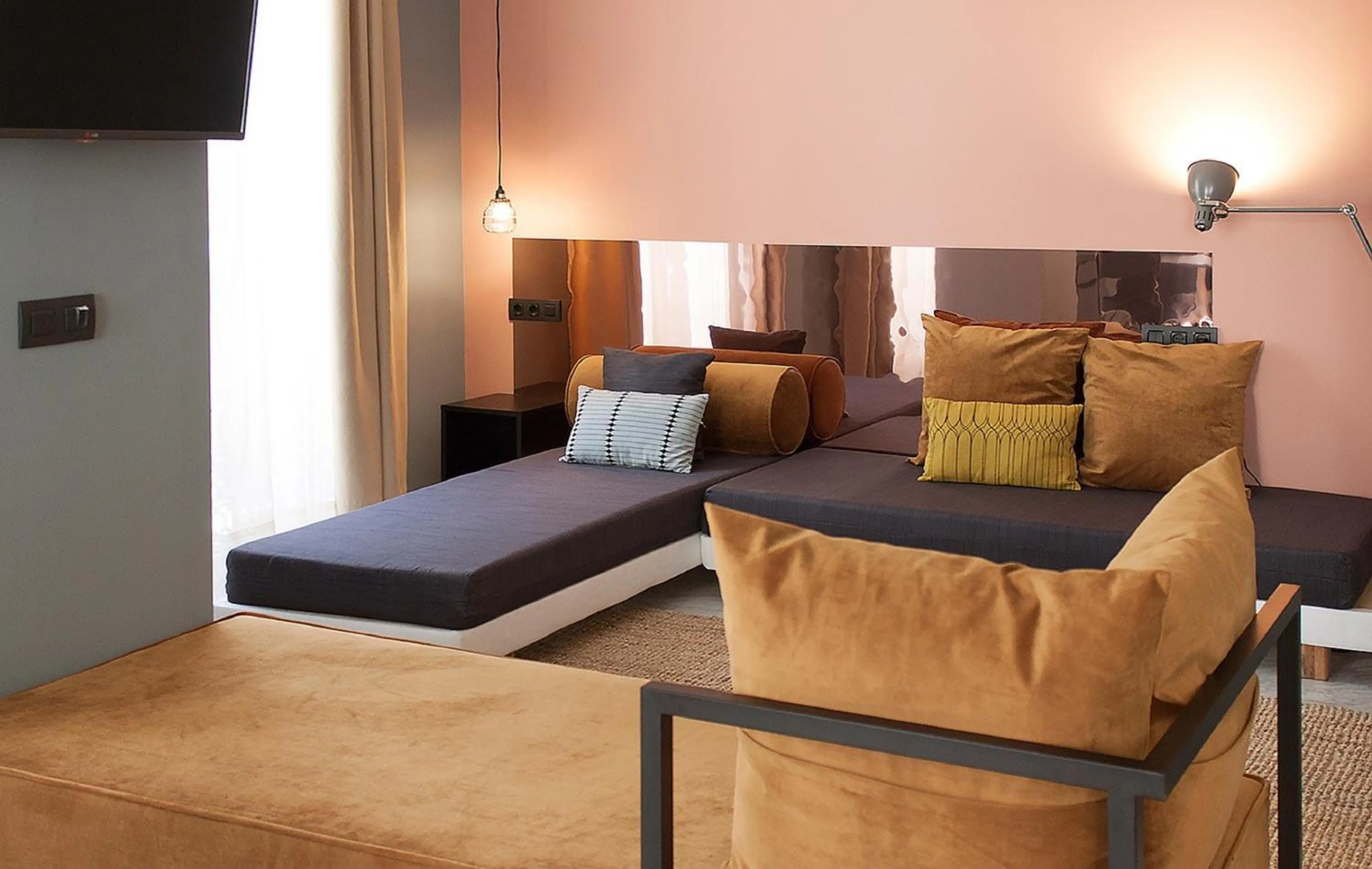 Seating area, Bed in Apartamentos NONO by Charming Stay