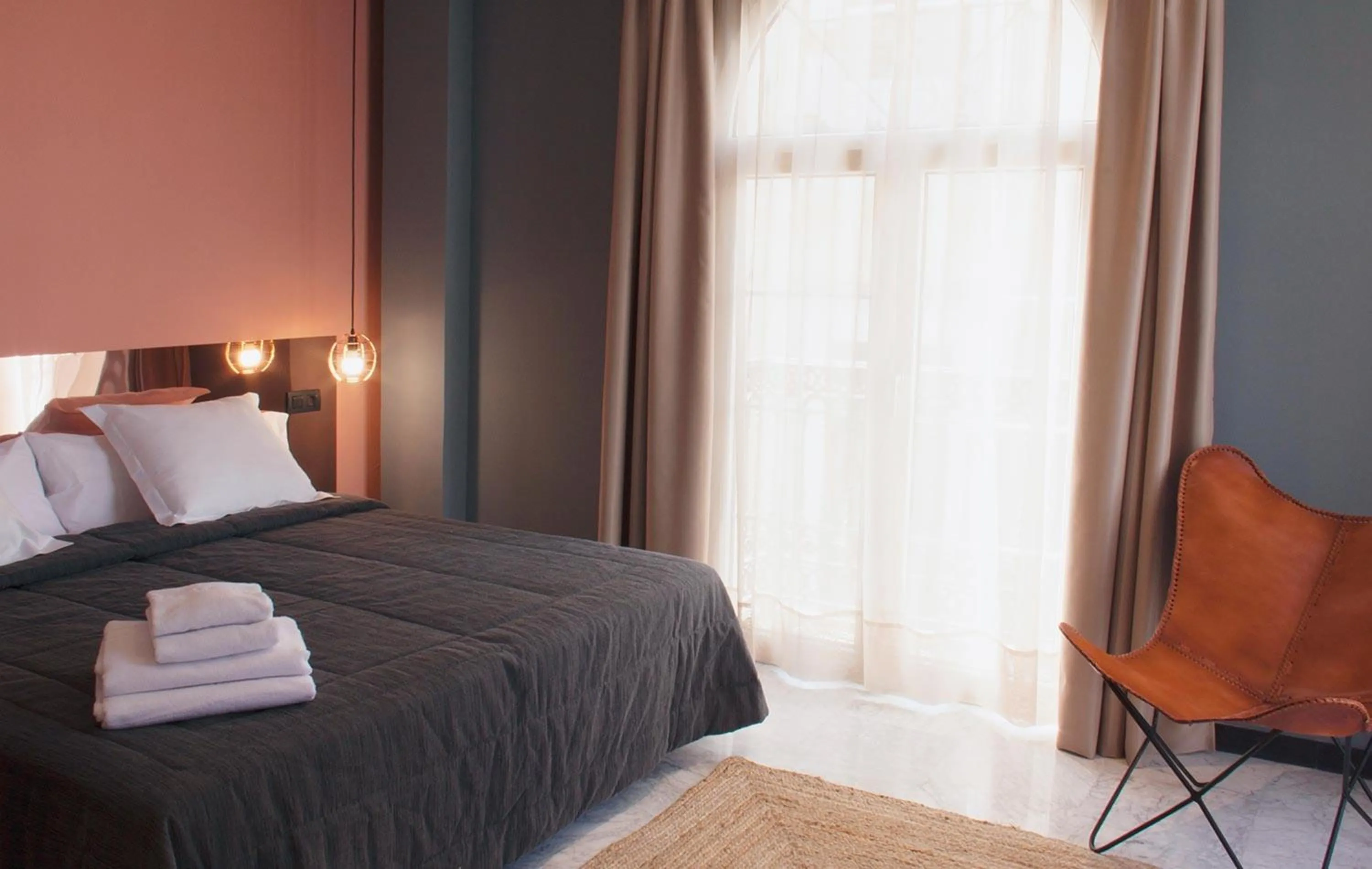 Bedroom, Bed in Apartamentos NONO by Charming Stay