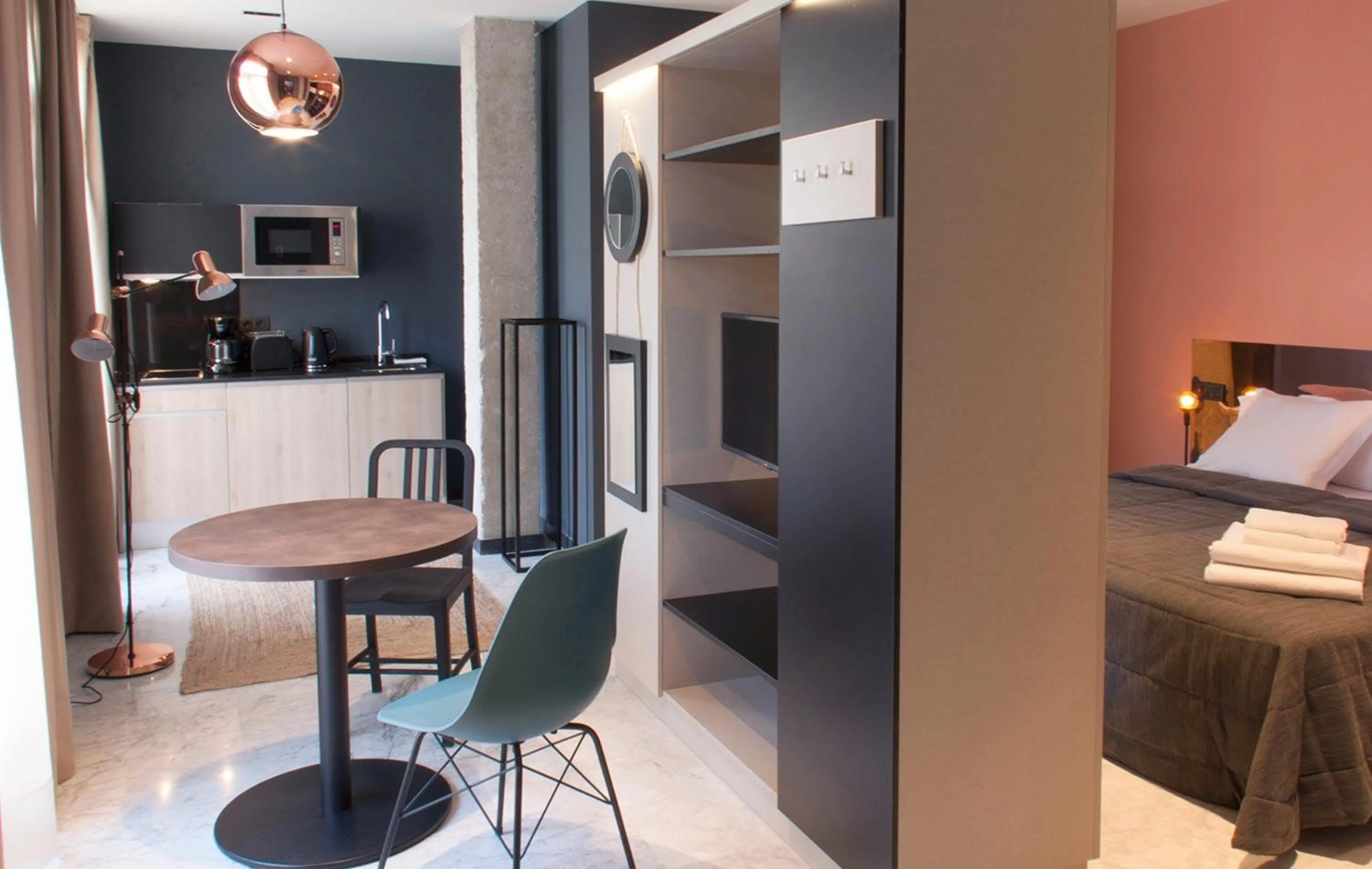 Living room, Bed in Apartamentos NONO by Charming Stay