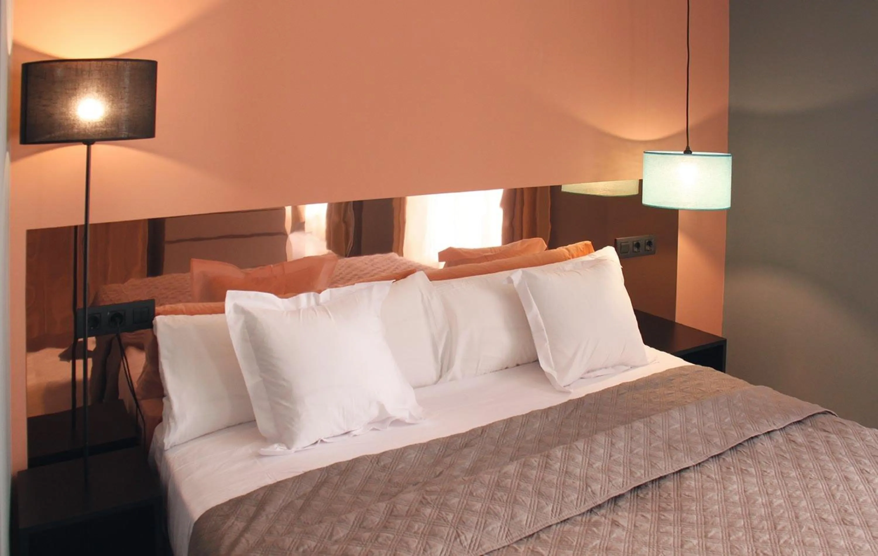 Bedroom, Bed in Apartamentos NONO by Charming Stay