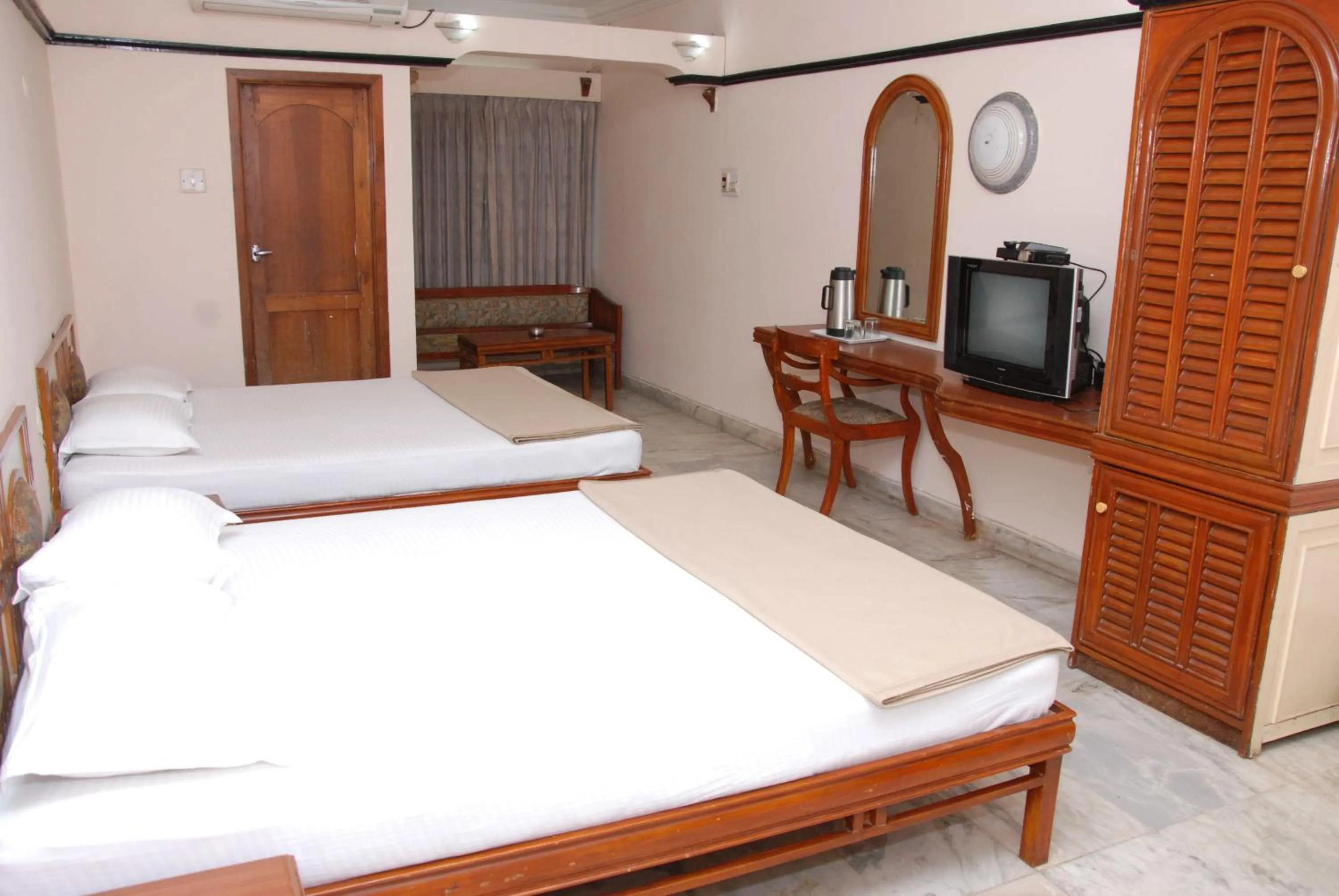 Bed in Amogha International Hotel