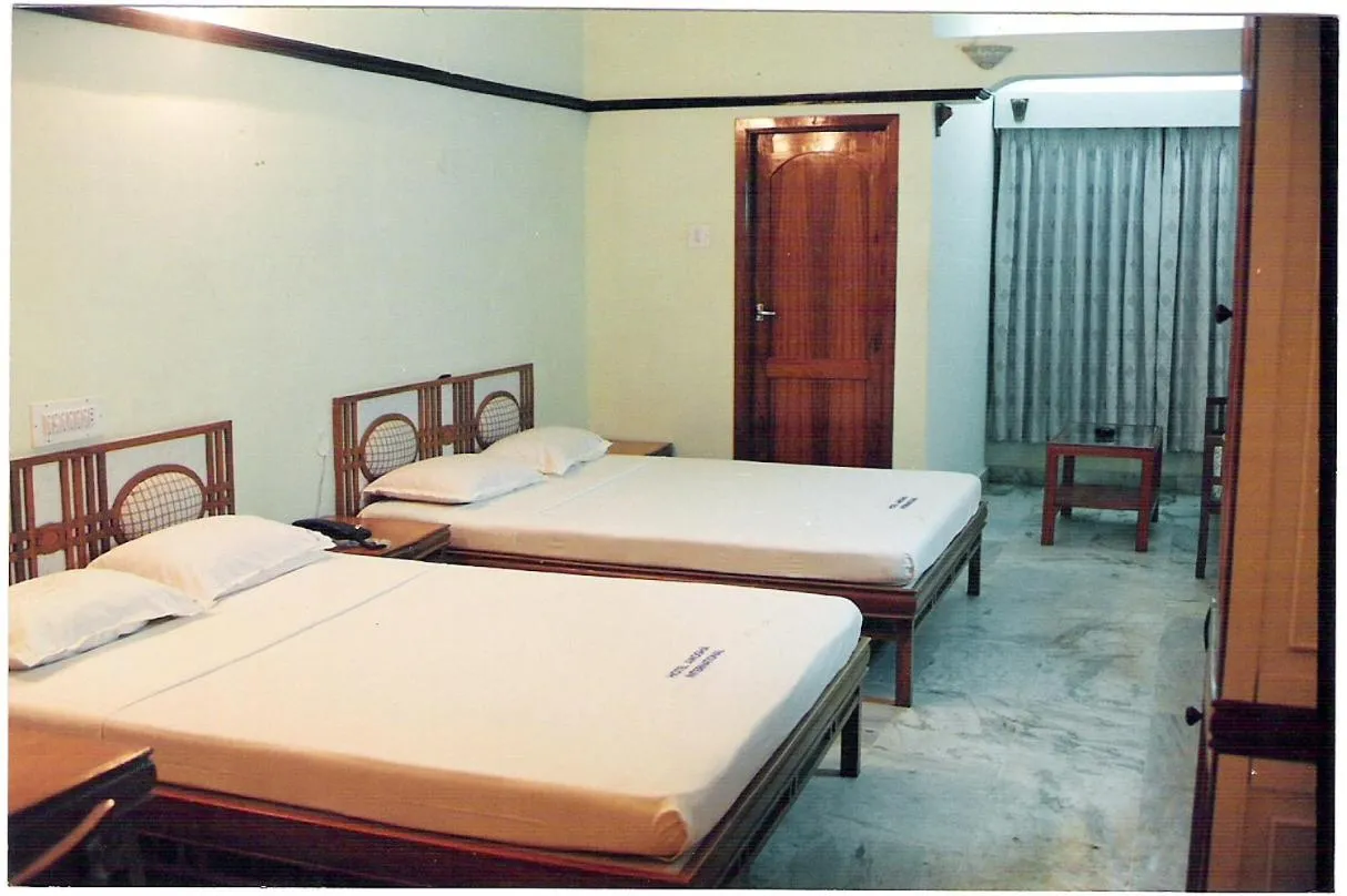 Bed in Amogha International Hotel