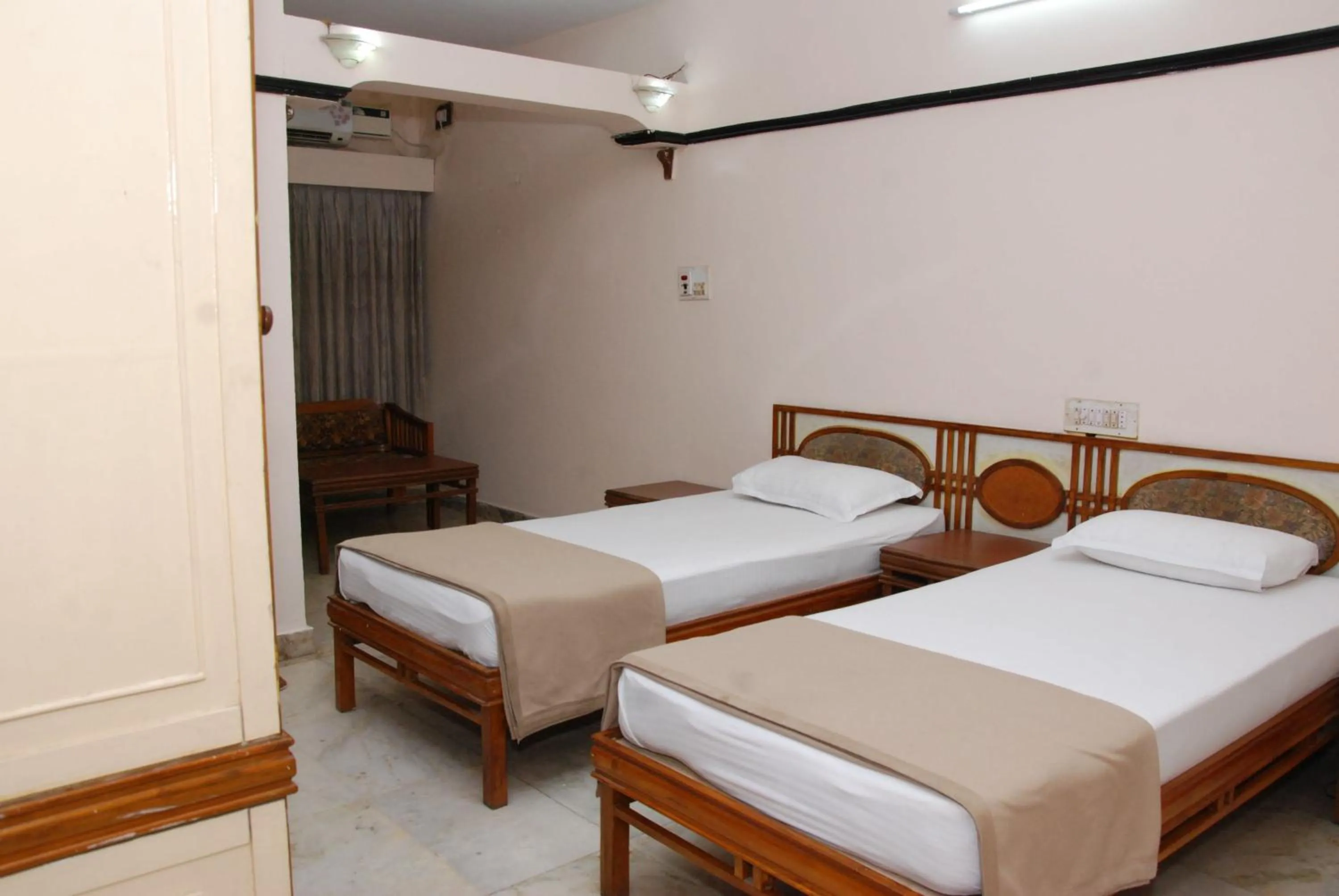 Photo of the whole room, Bed in Amogha International Hotel
