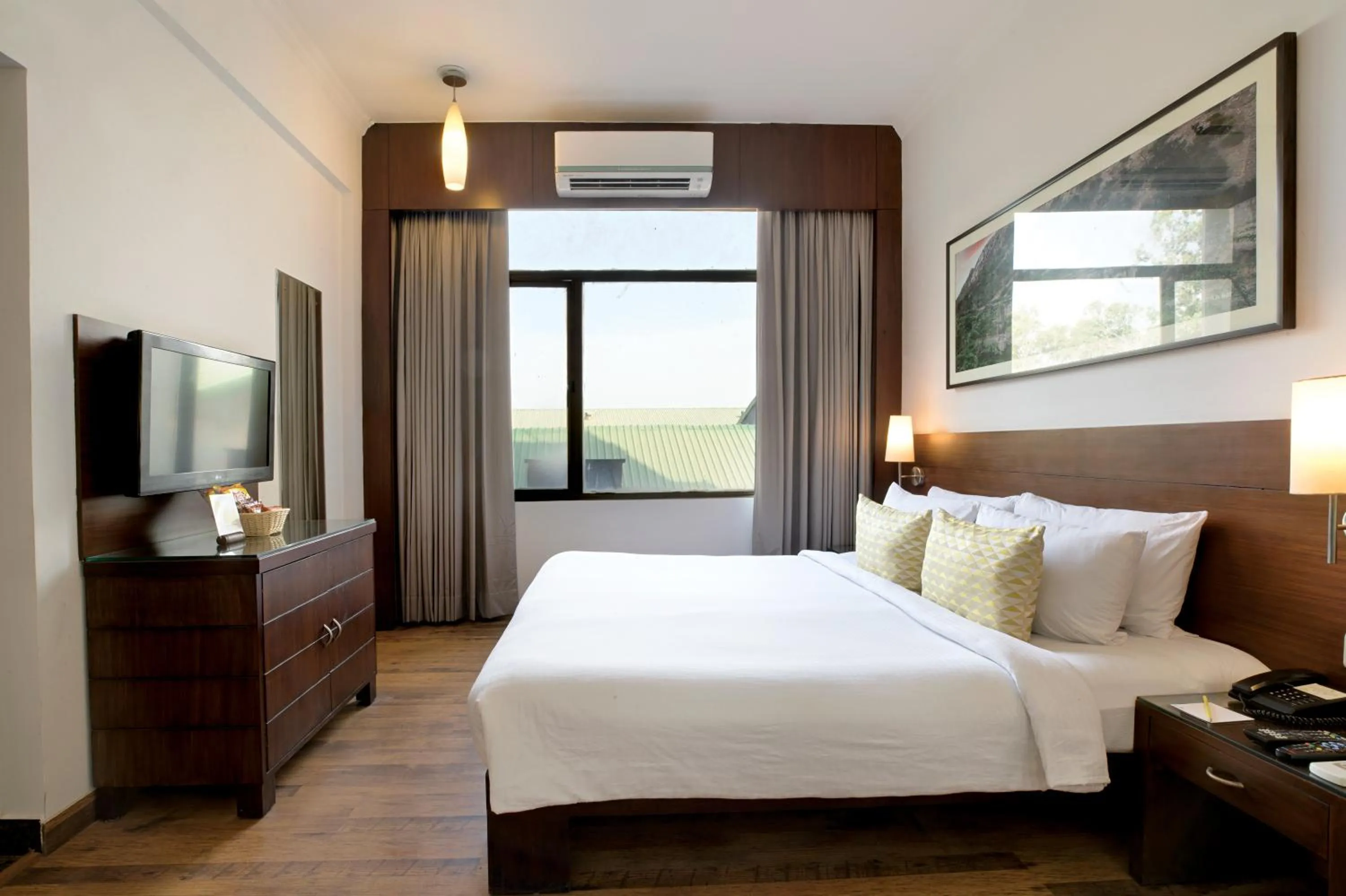 Bed in Lemon Tree Hotel Alwar,Sariska