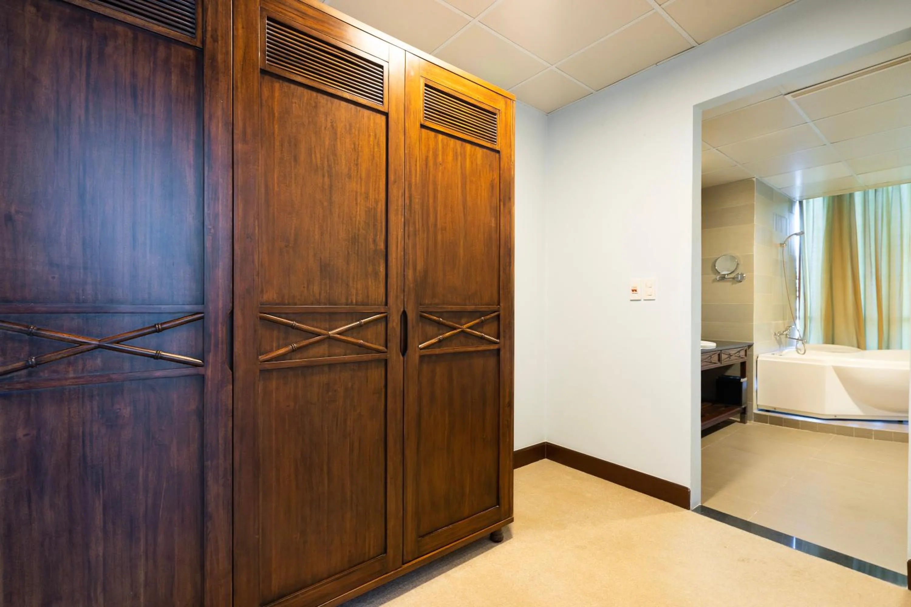 wardrobe, Bed in PHU MY HARBOUR HOTEL - Old Golf Phu My Hotel