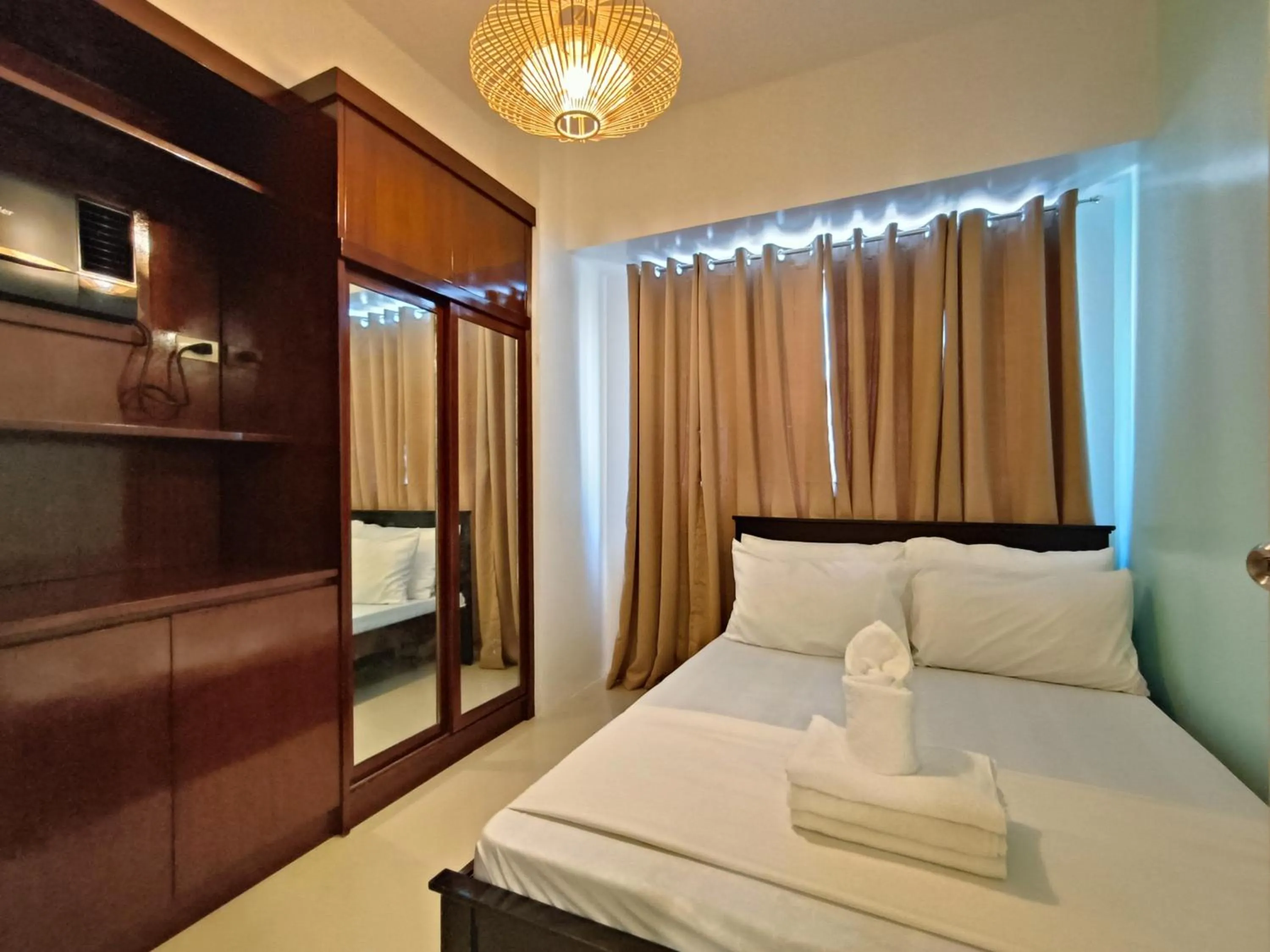 Bed in Premiere Haven MOA Staycation