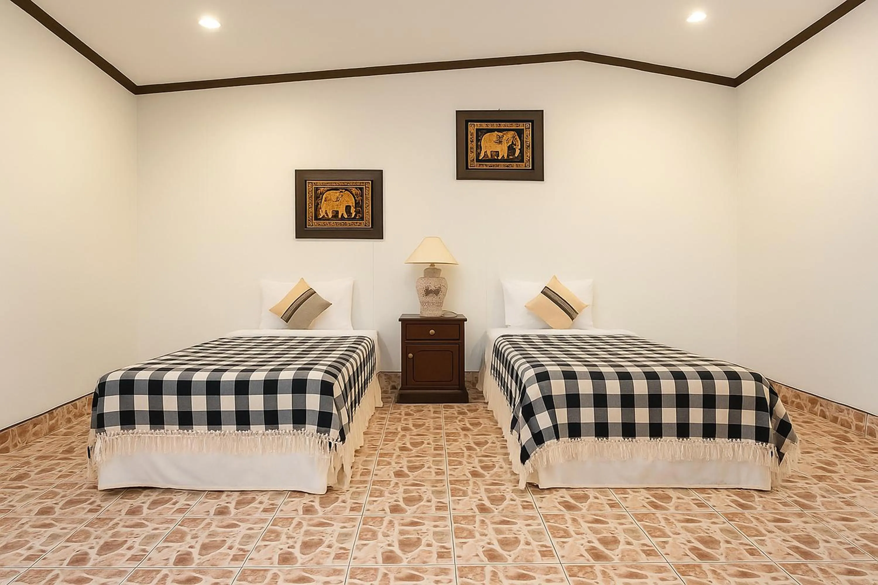 Bed in Kamala Orchid Guesthouse