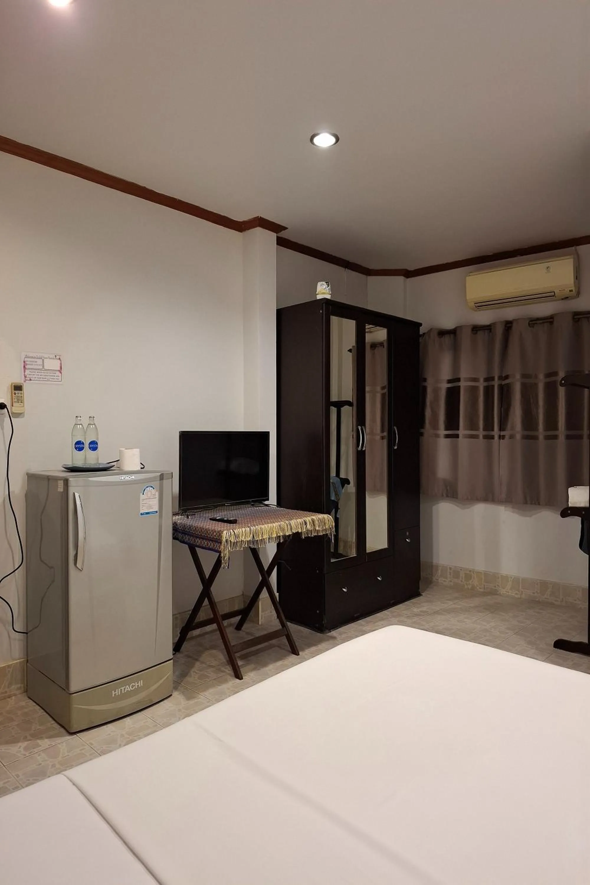 Bed in Kamala Orchid Guesthouse