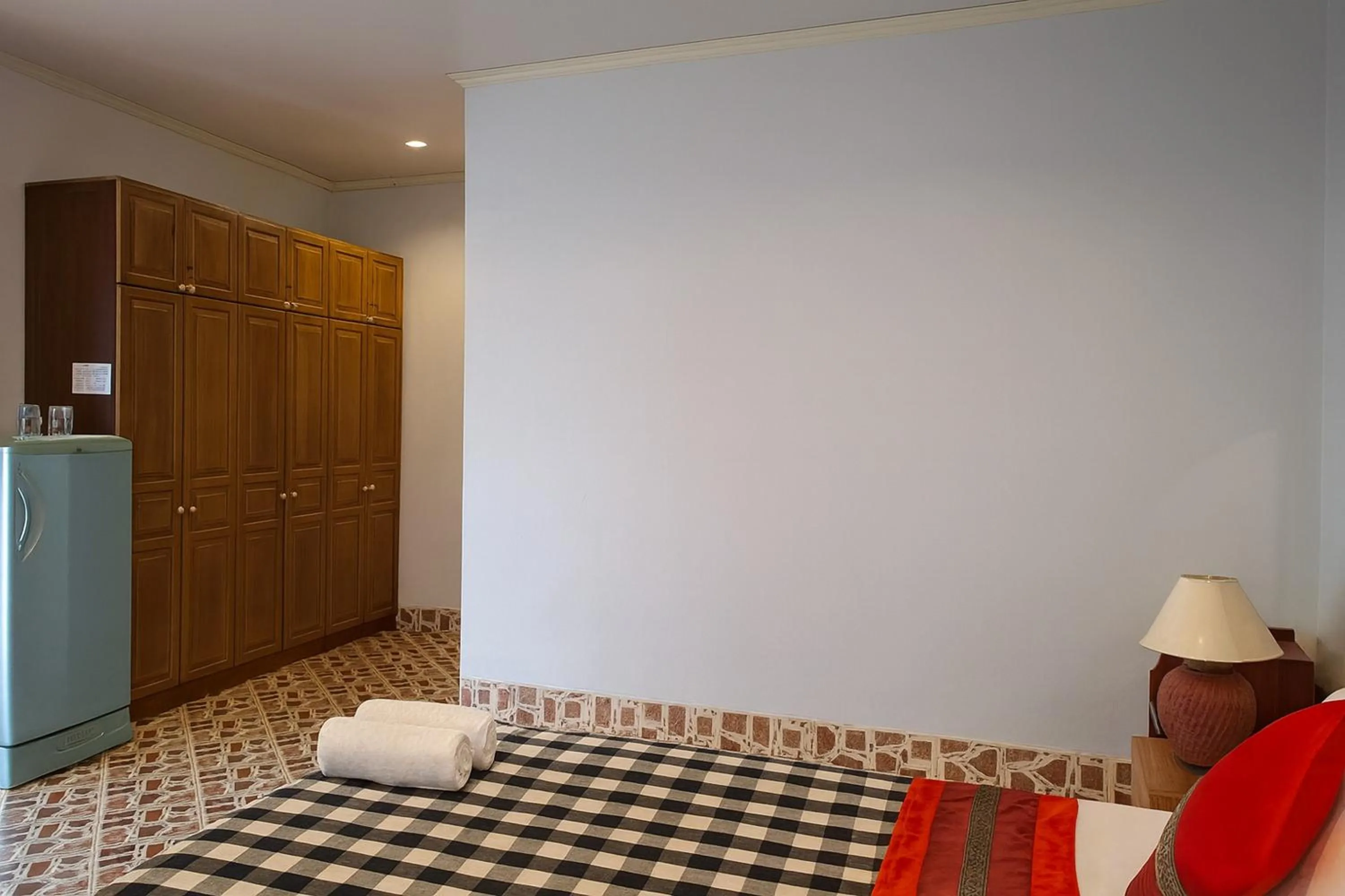 Bed in Kamala Orchid Guesthouse