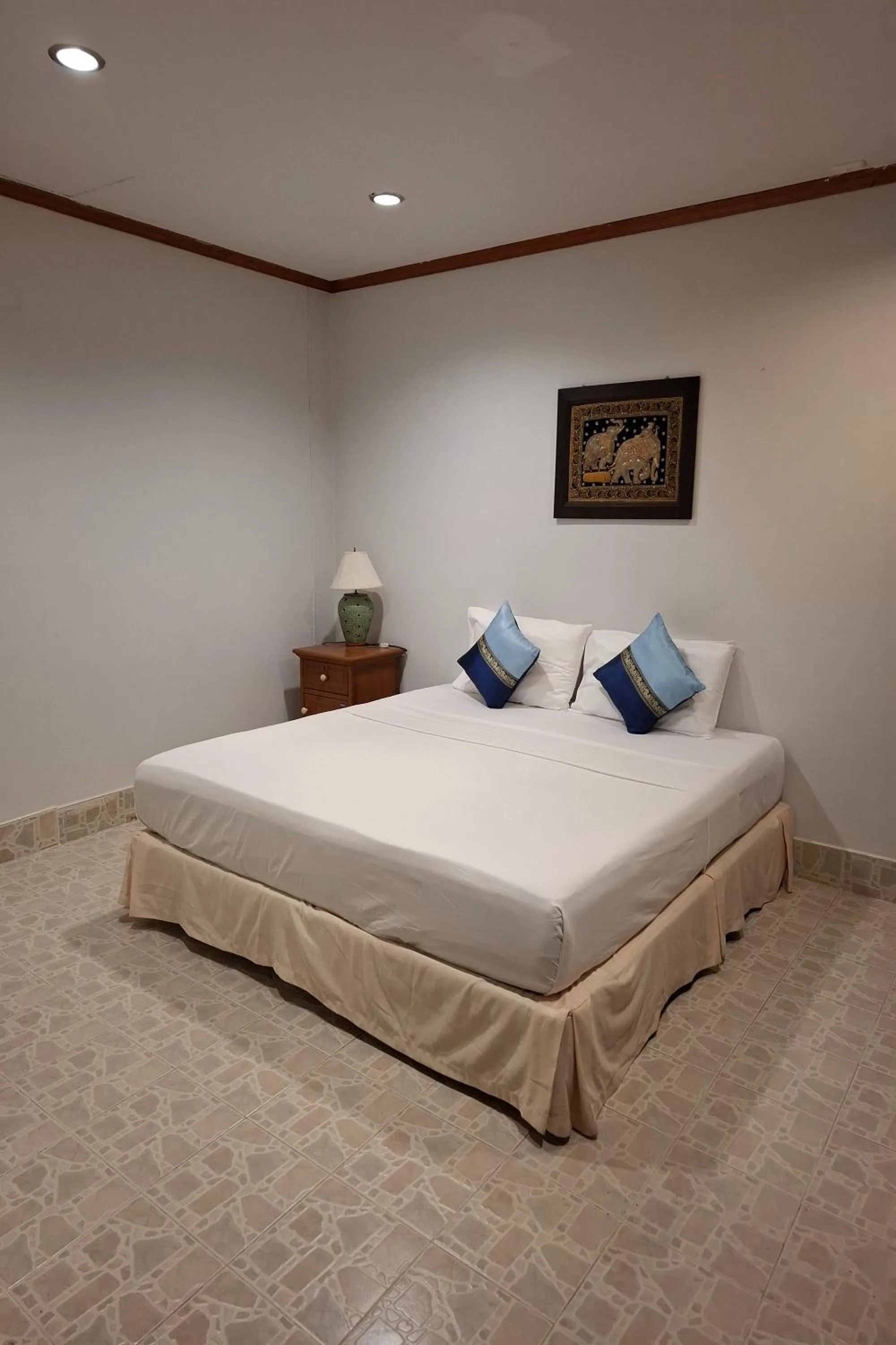 Bed in Kamala Orchid Guesthouse