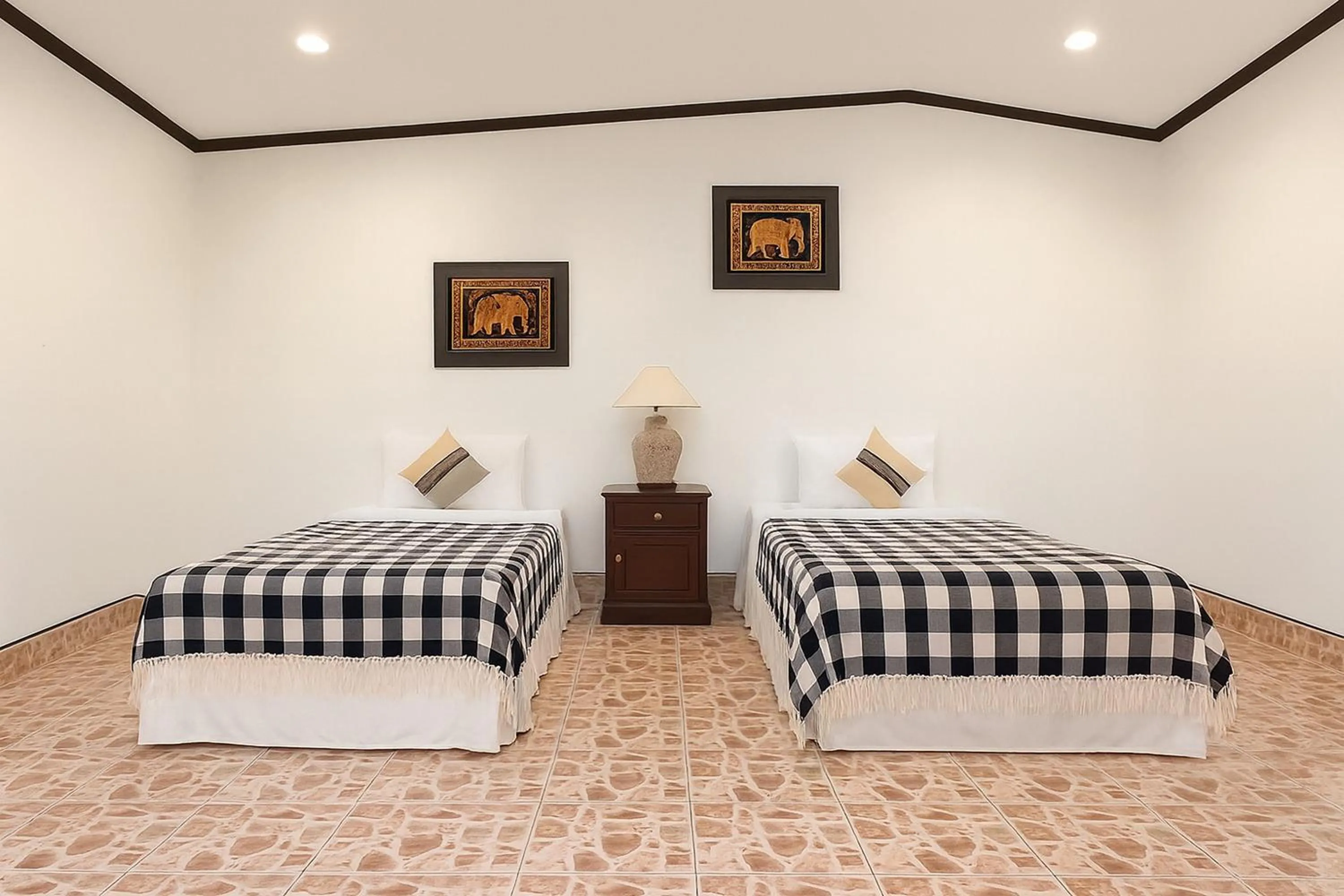 Bed in Kamala Orchid Guesthouse