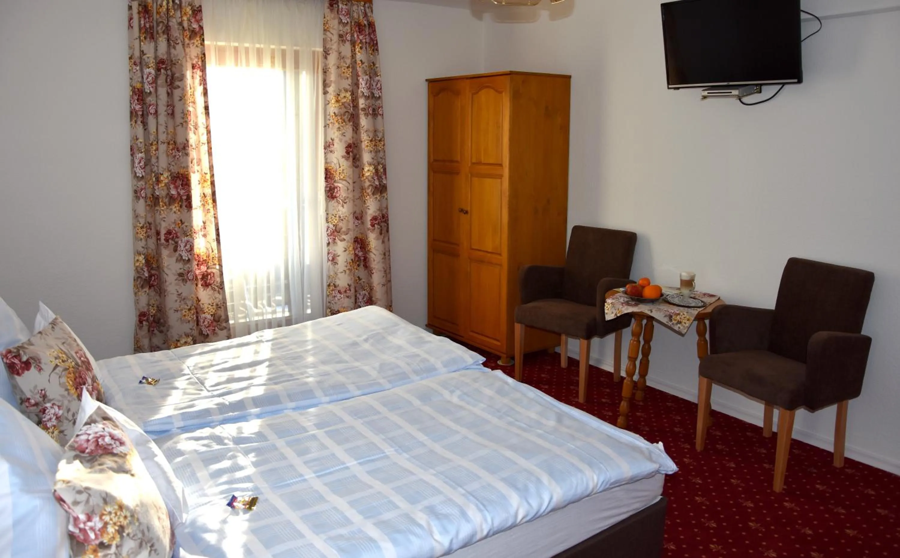 Seating area, Bed in Hotel Tannenhof