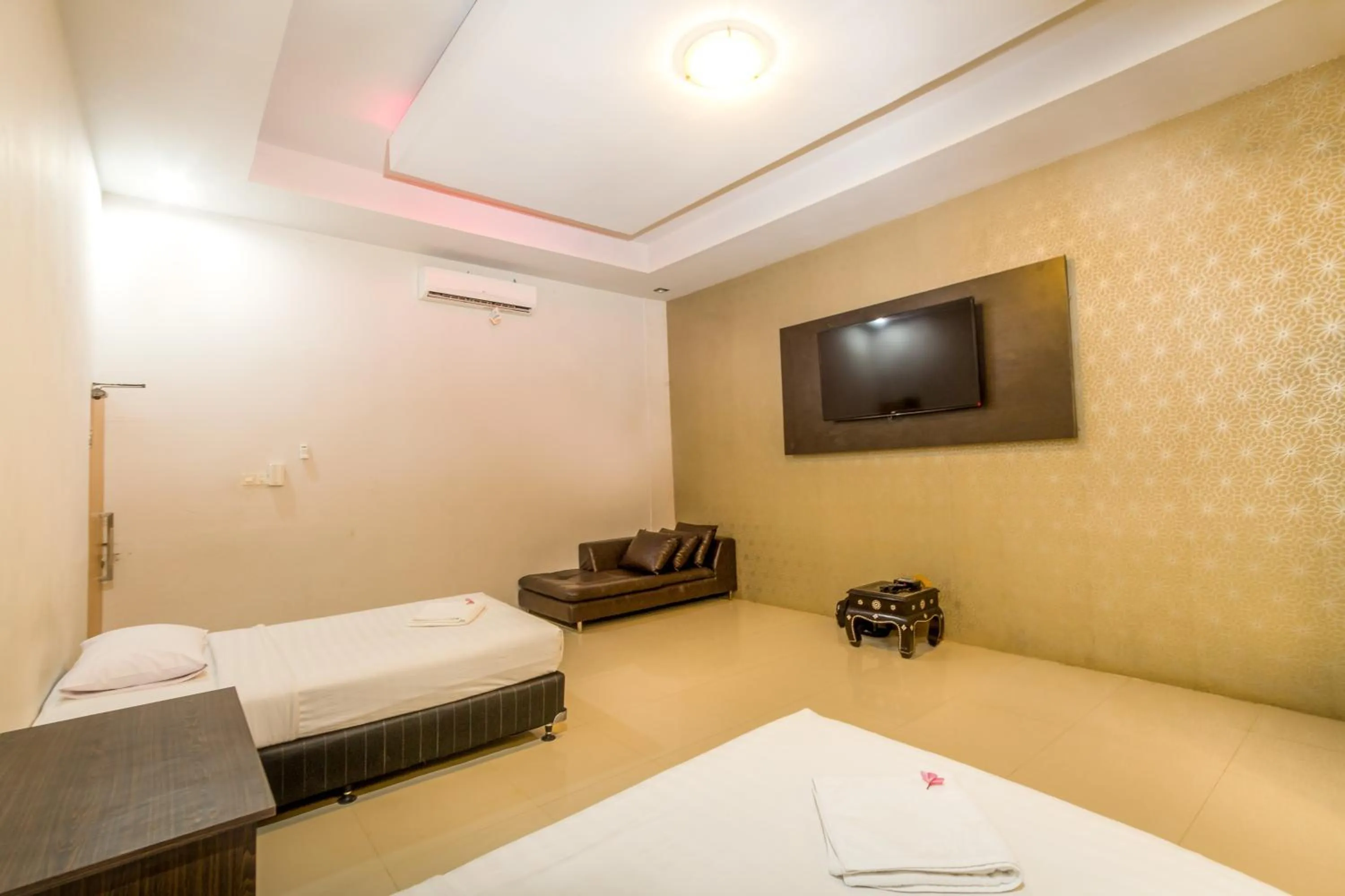 Photo of the whole room, Bed in JM Hotel Kuta Lombok