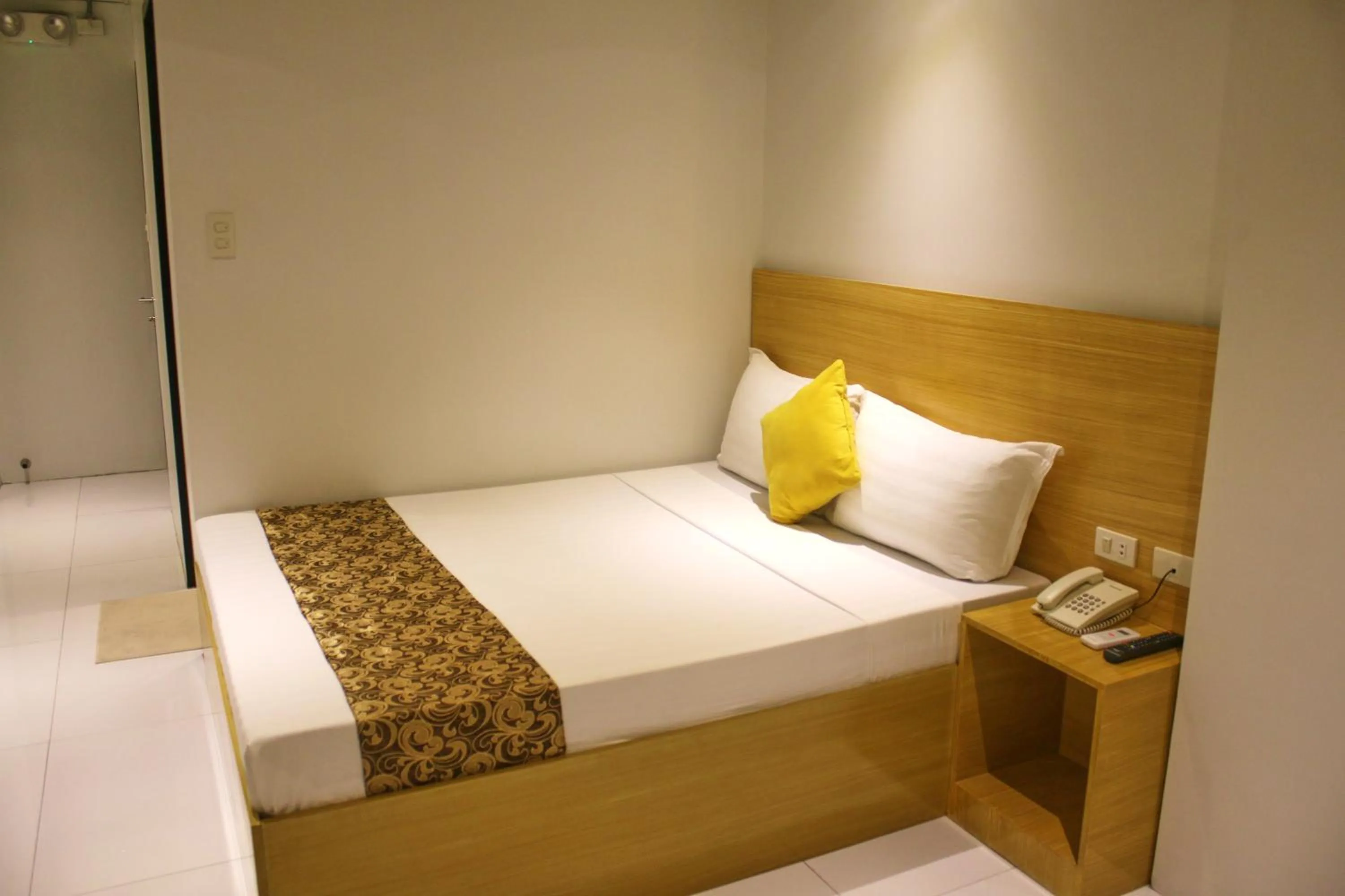 Bed in LuxeLite Suites Pasay
