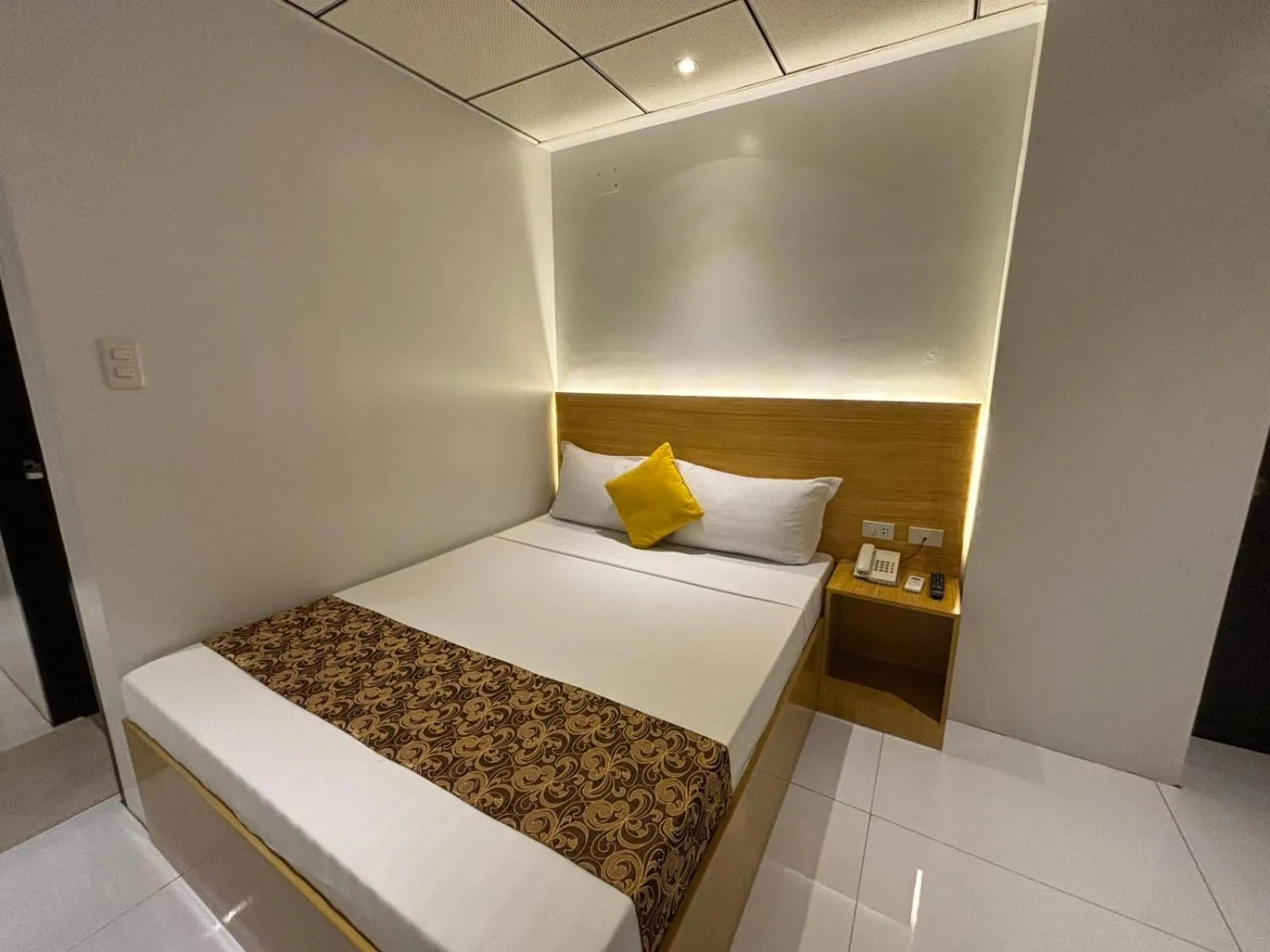 Bed in LuxeLite Suites Pasay