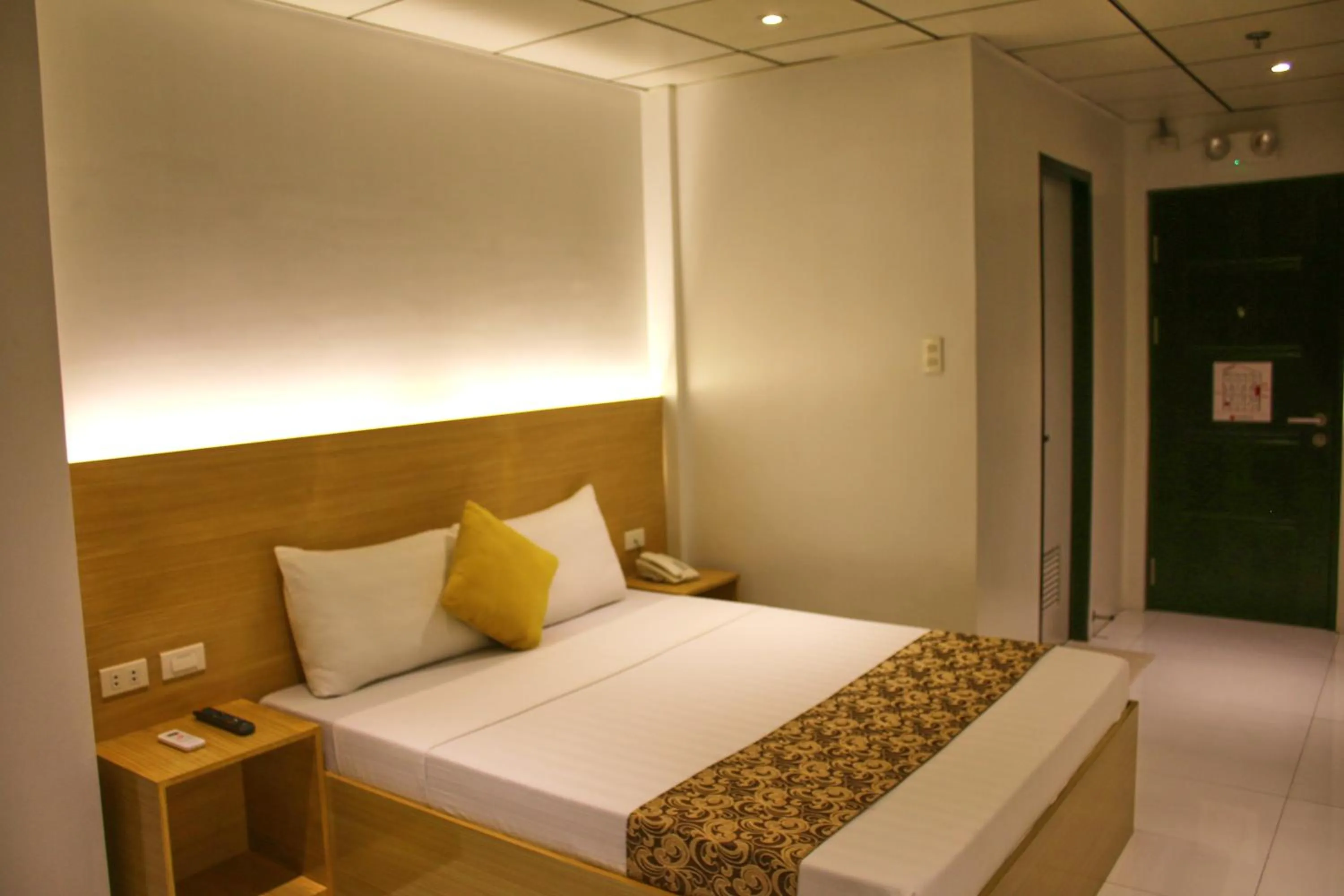 Bed in LuxeLite Suites Pasay