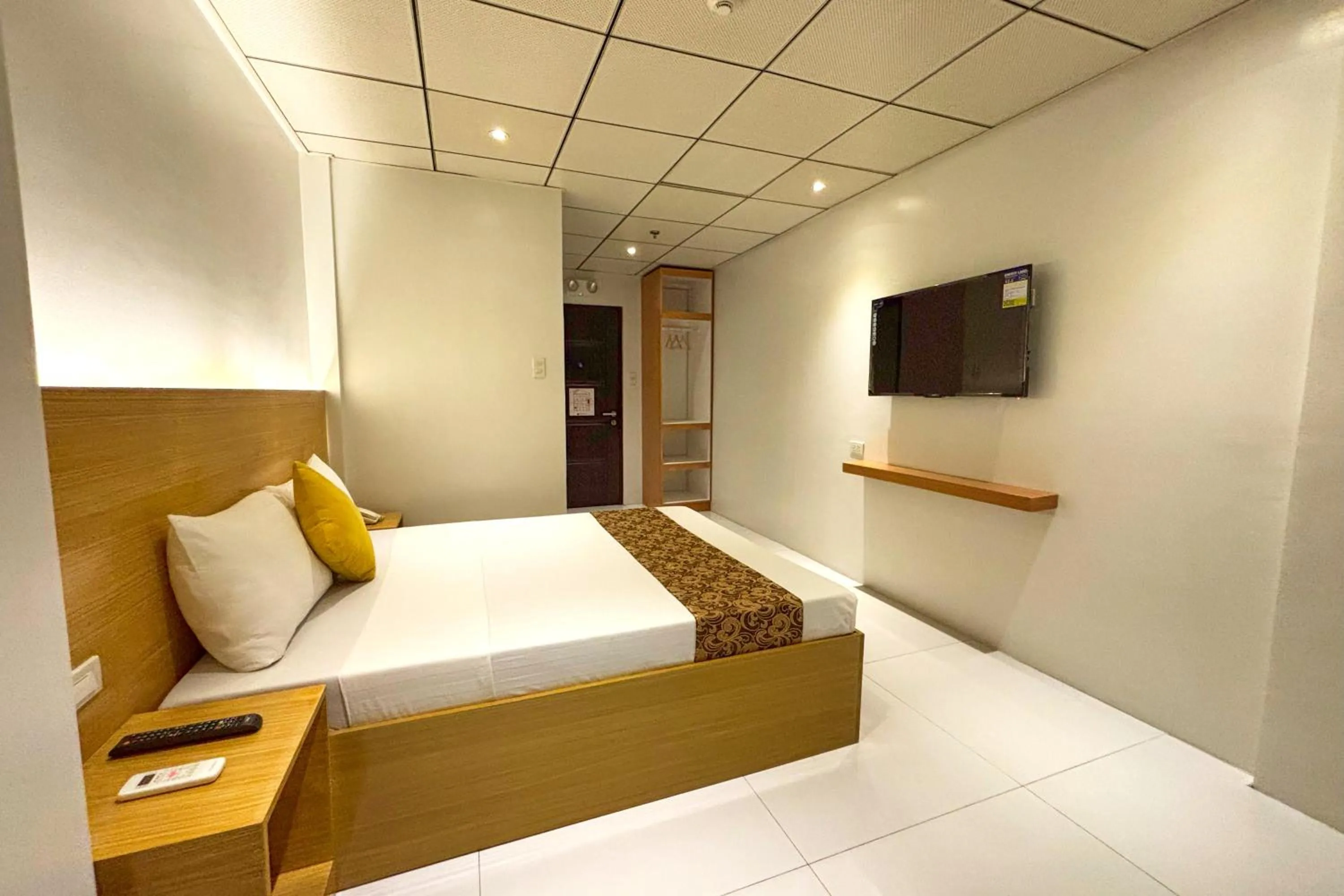 Bed in LuxeLite Suites Pasay