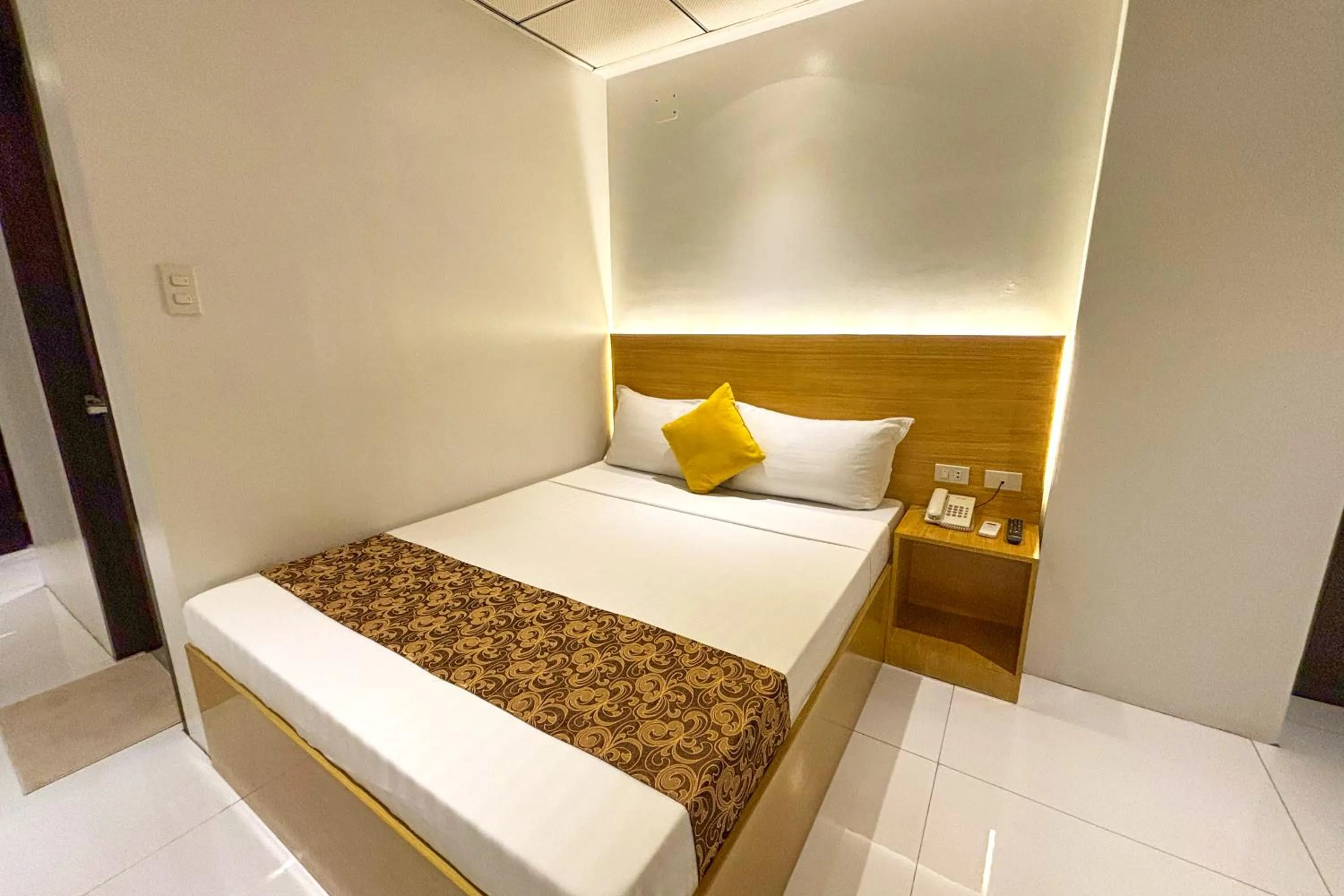 Bed in LuxeLite Suites Pasay