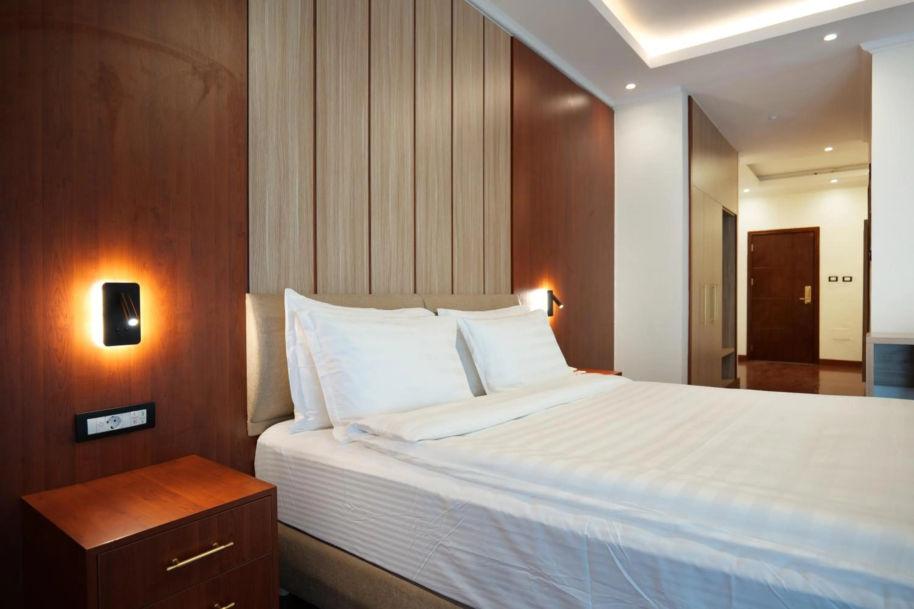 Bed in Crescent International Hotel