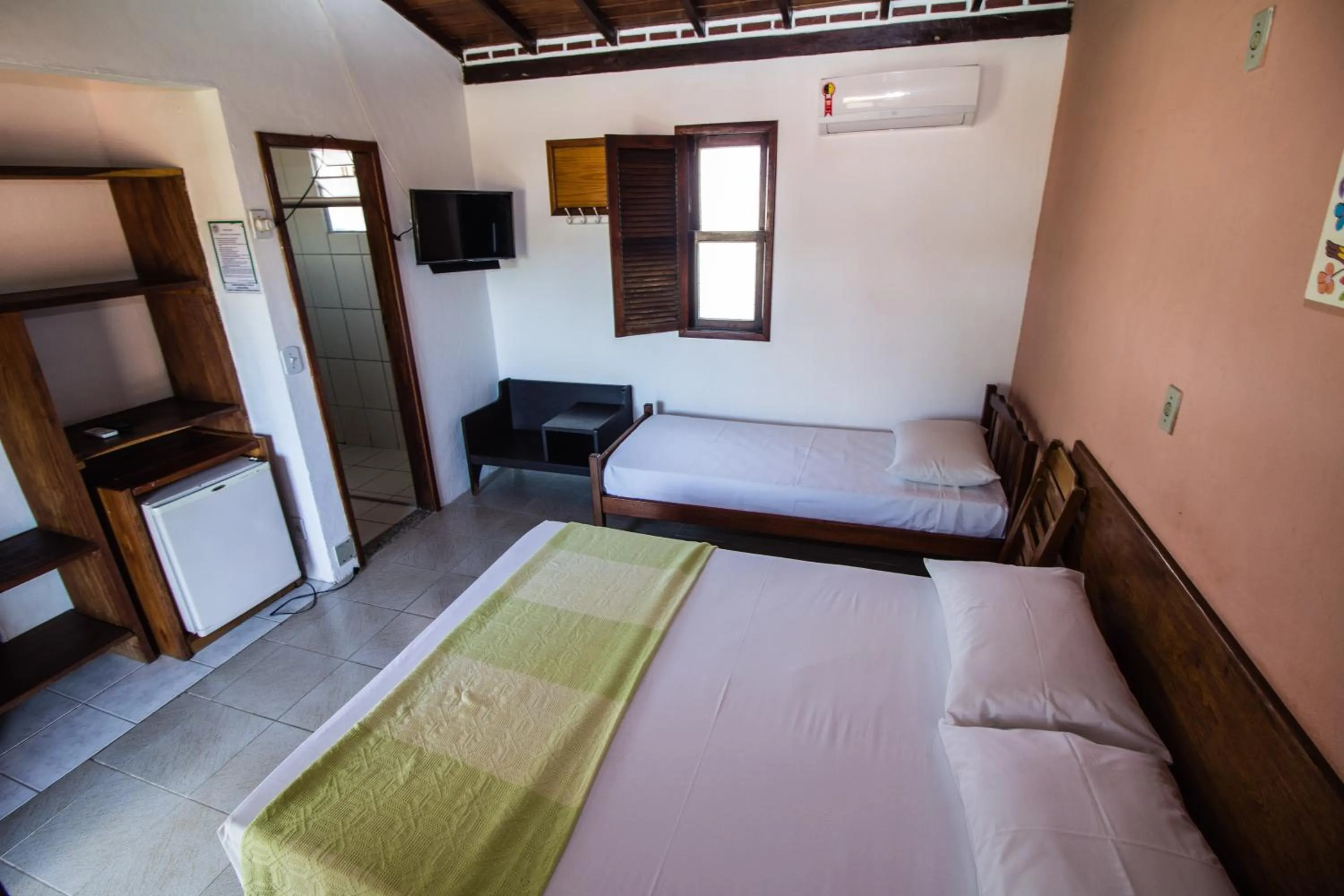 Bed in Pousada Manga Rosa- Arraial