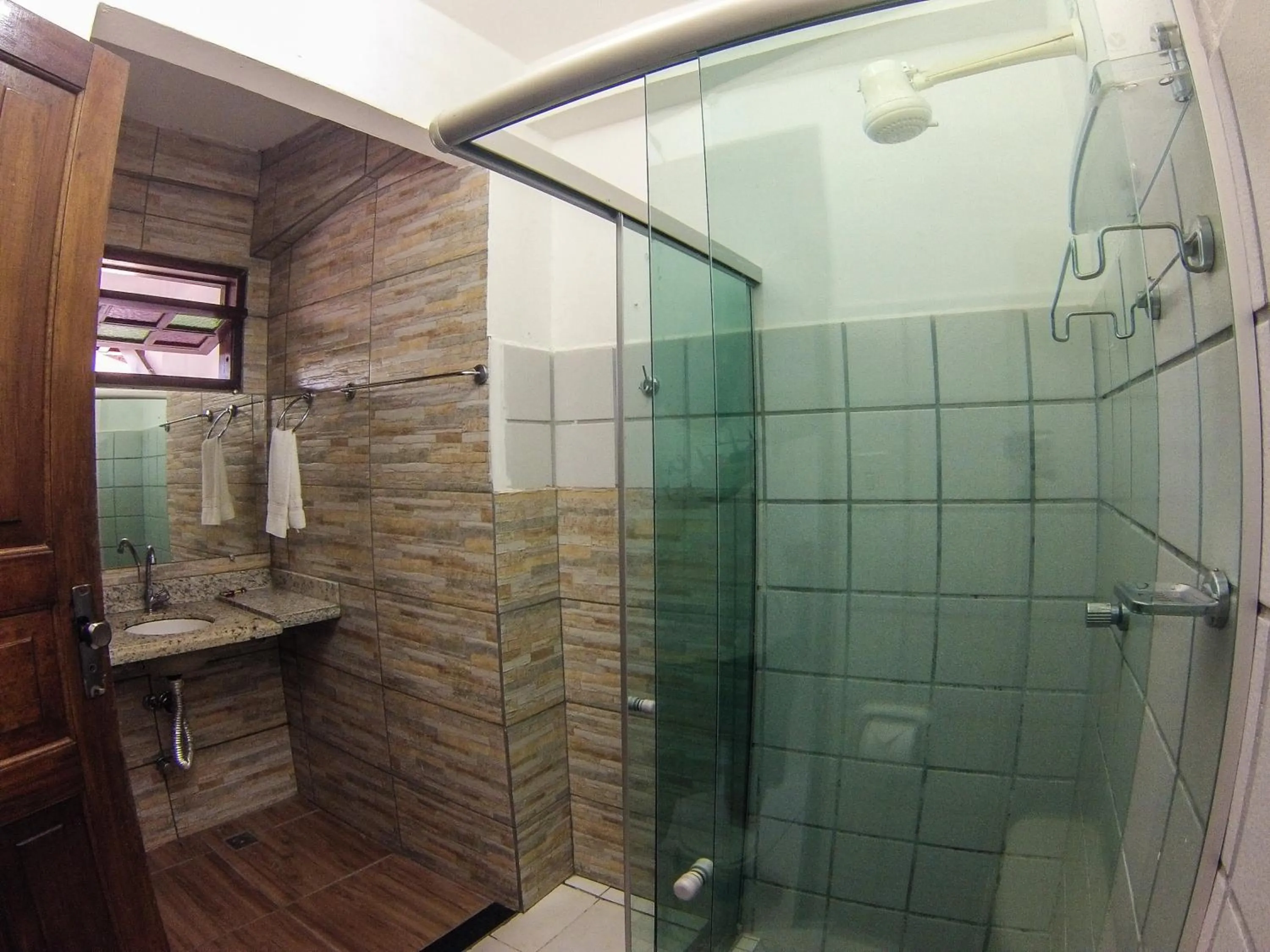 Bathroom in Pousada Manga Rosa- Arraial