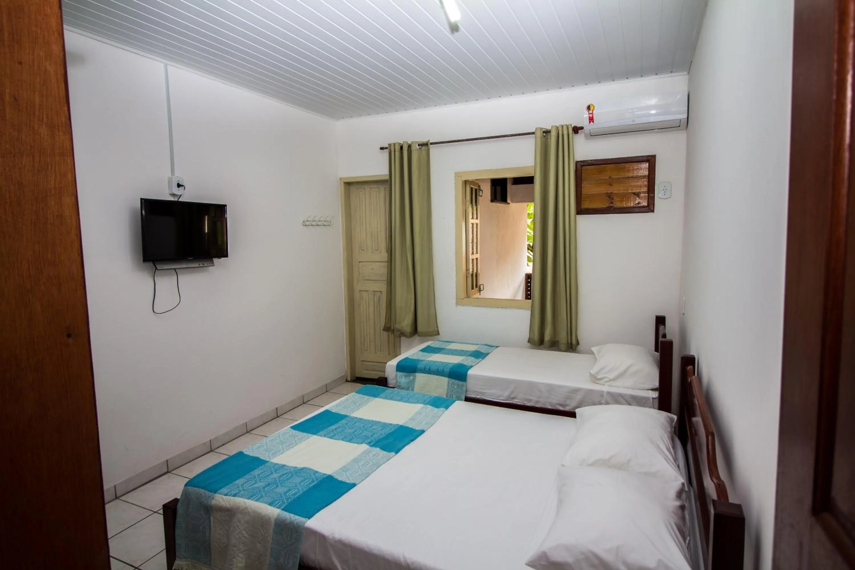 Bed in Pousada Manga Rosa- Arraial