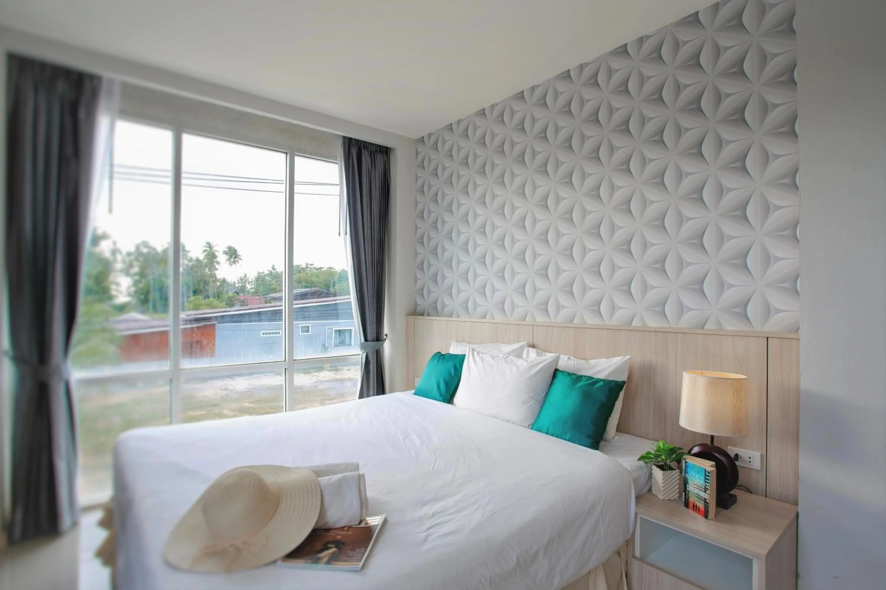 Bed in The Wings Boutique Hotels Krabi Ko Lanta