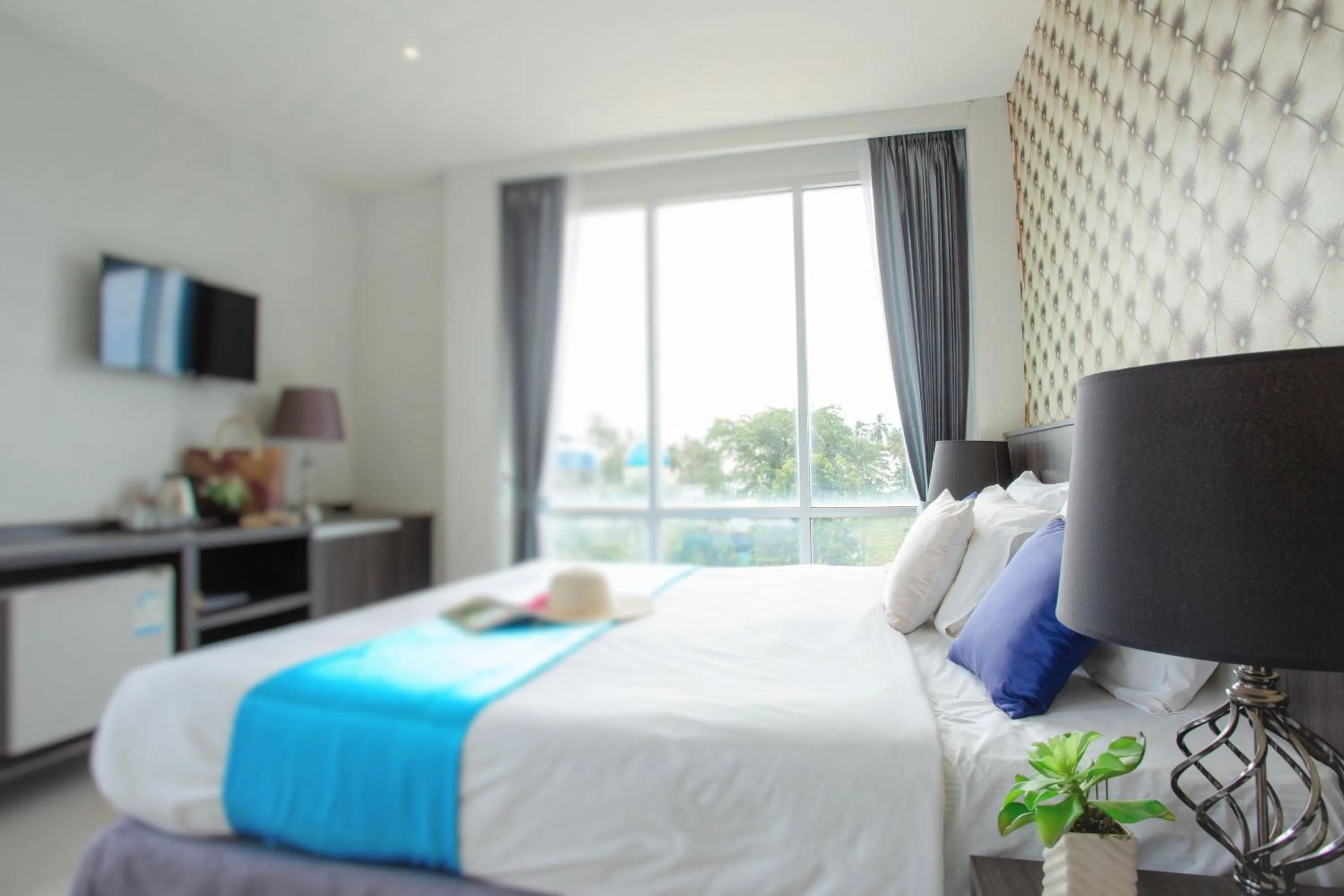 Communal lounge/ TV room, Bed in The Wings Boutique Hotels Krabi Ko Lanta