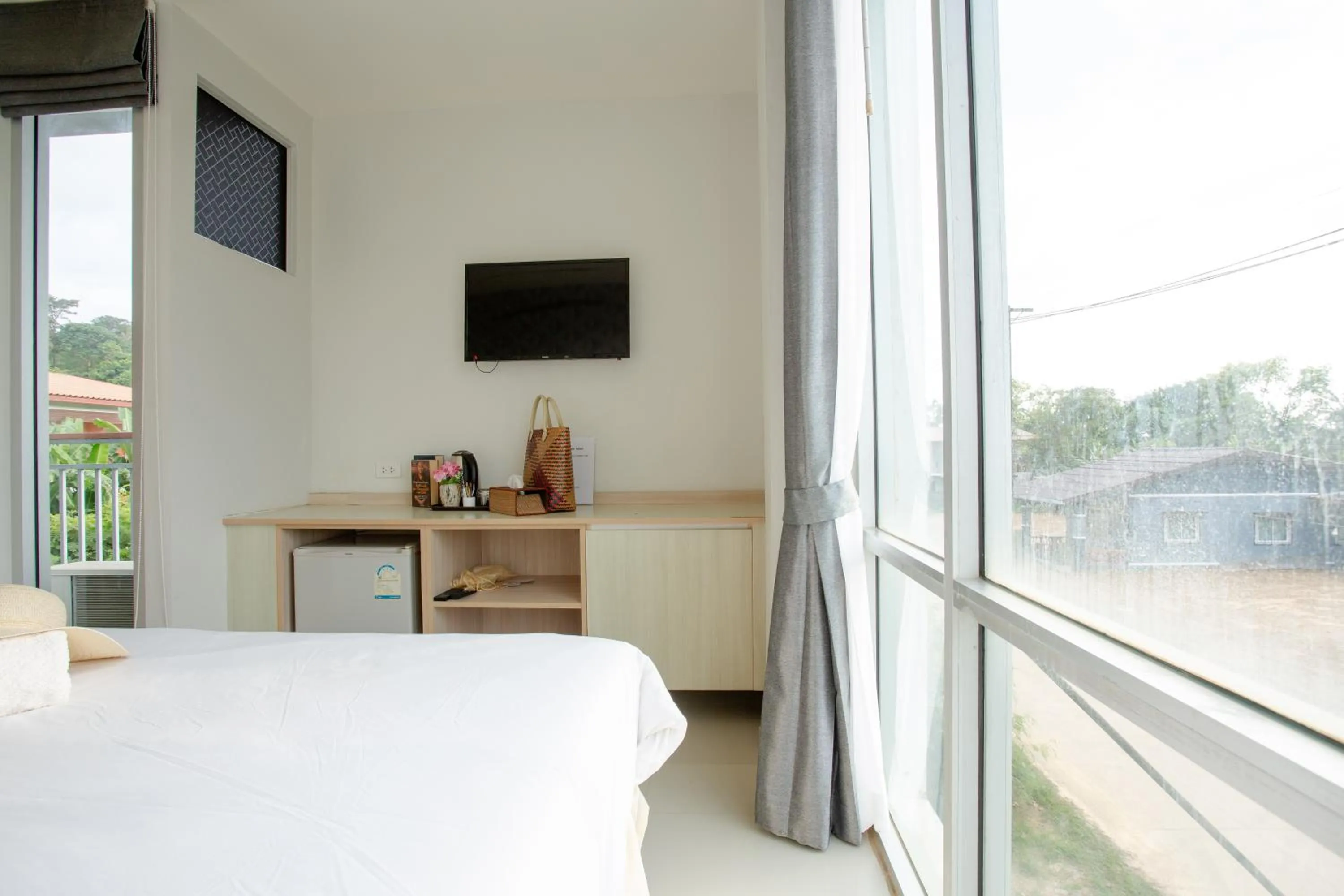 Communal lounge/ TV room, Bed in The Wings Boutique Hotels Krabi Ko Lanta