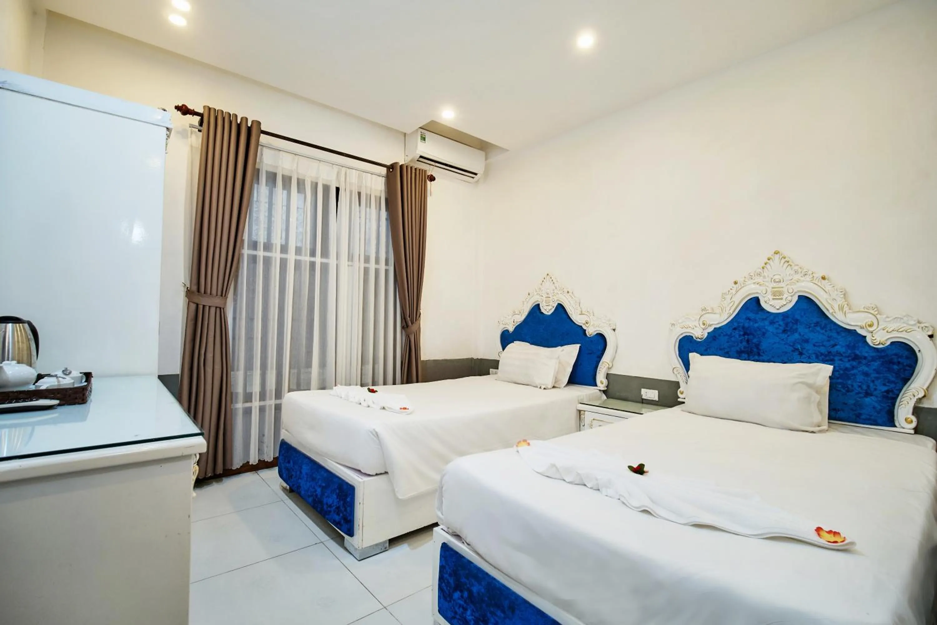 Bed in Hoian Nostalgia Hotel