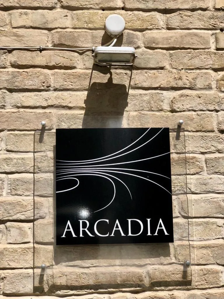Property logo or sign in Hotel Arcadia