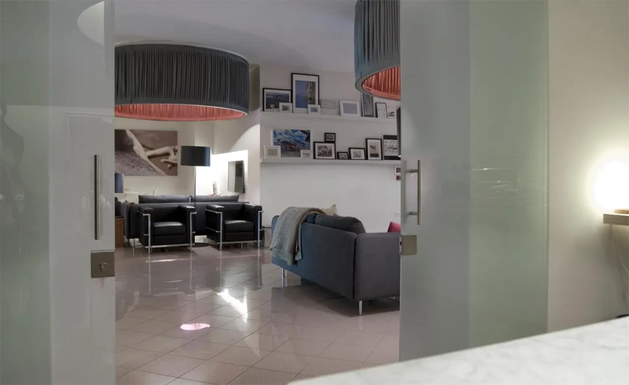 Communal lounge/ TV room, Bed in Hotel Oliva