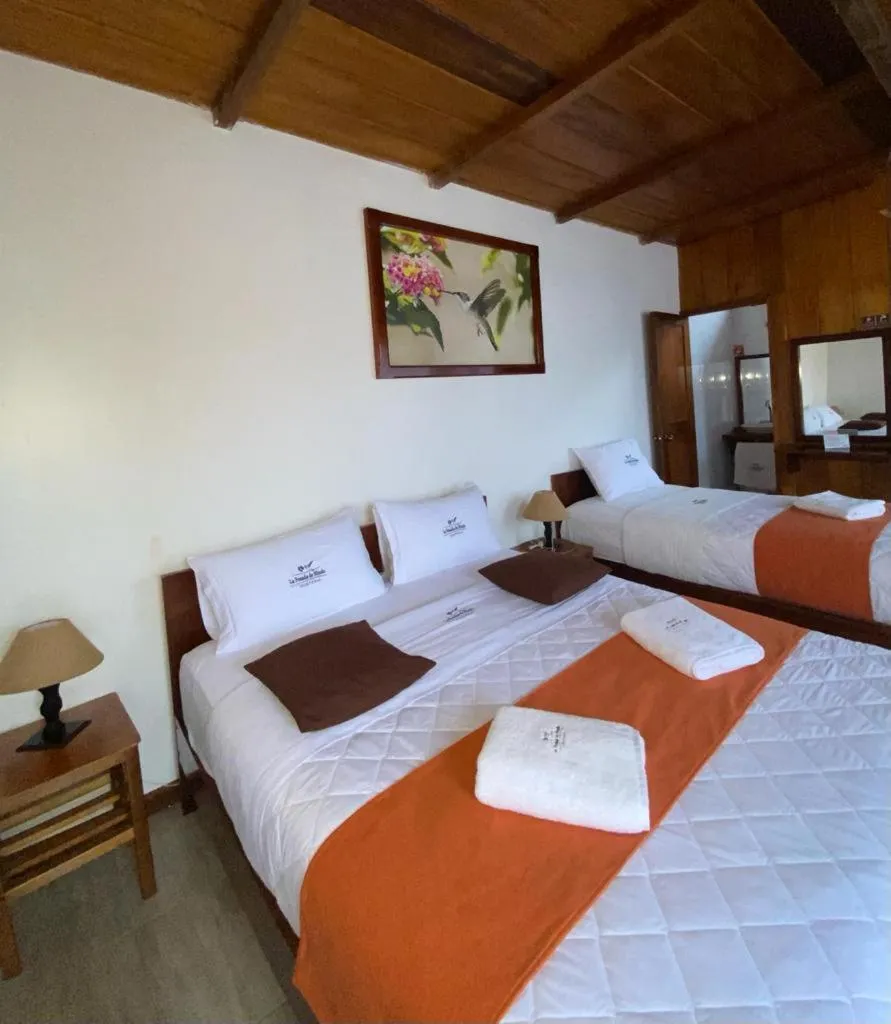 Bed in La Posada de Mindo