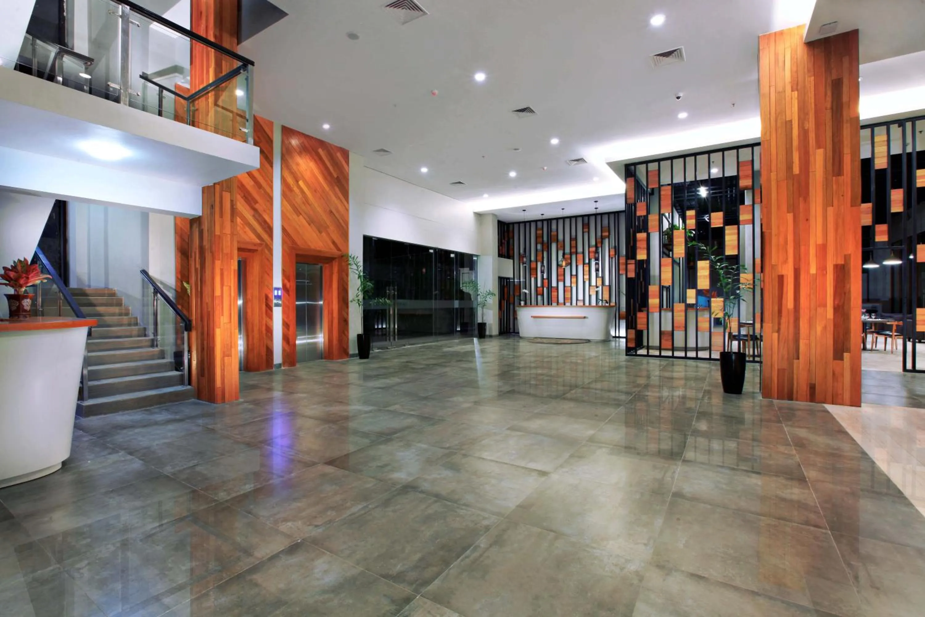 Lobby or reception in Harper Purwakarta by ASTON