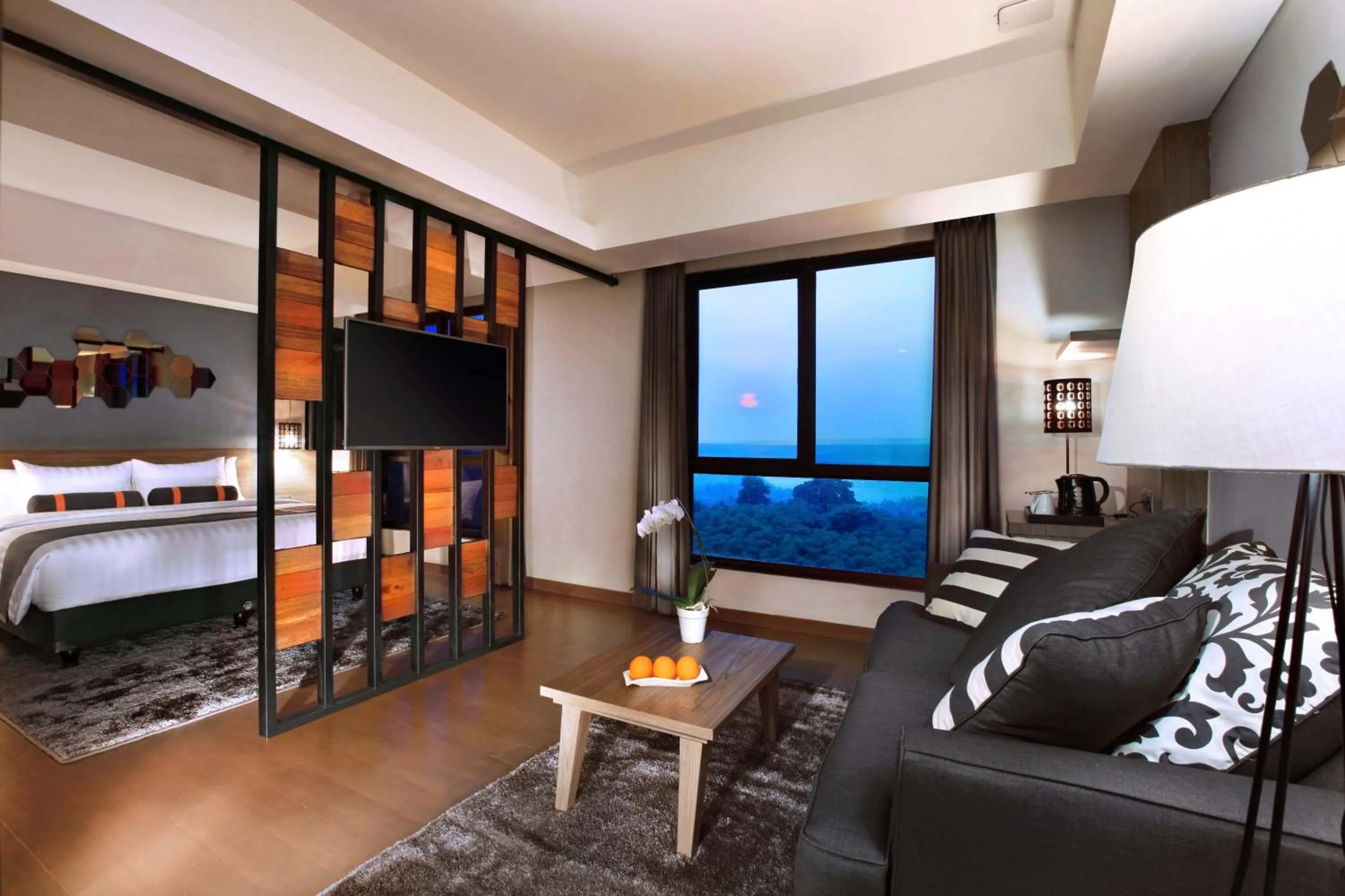 Seating area, Bed in Harper Purwakarta by ASTON