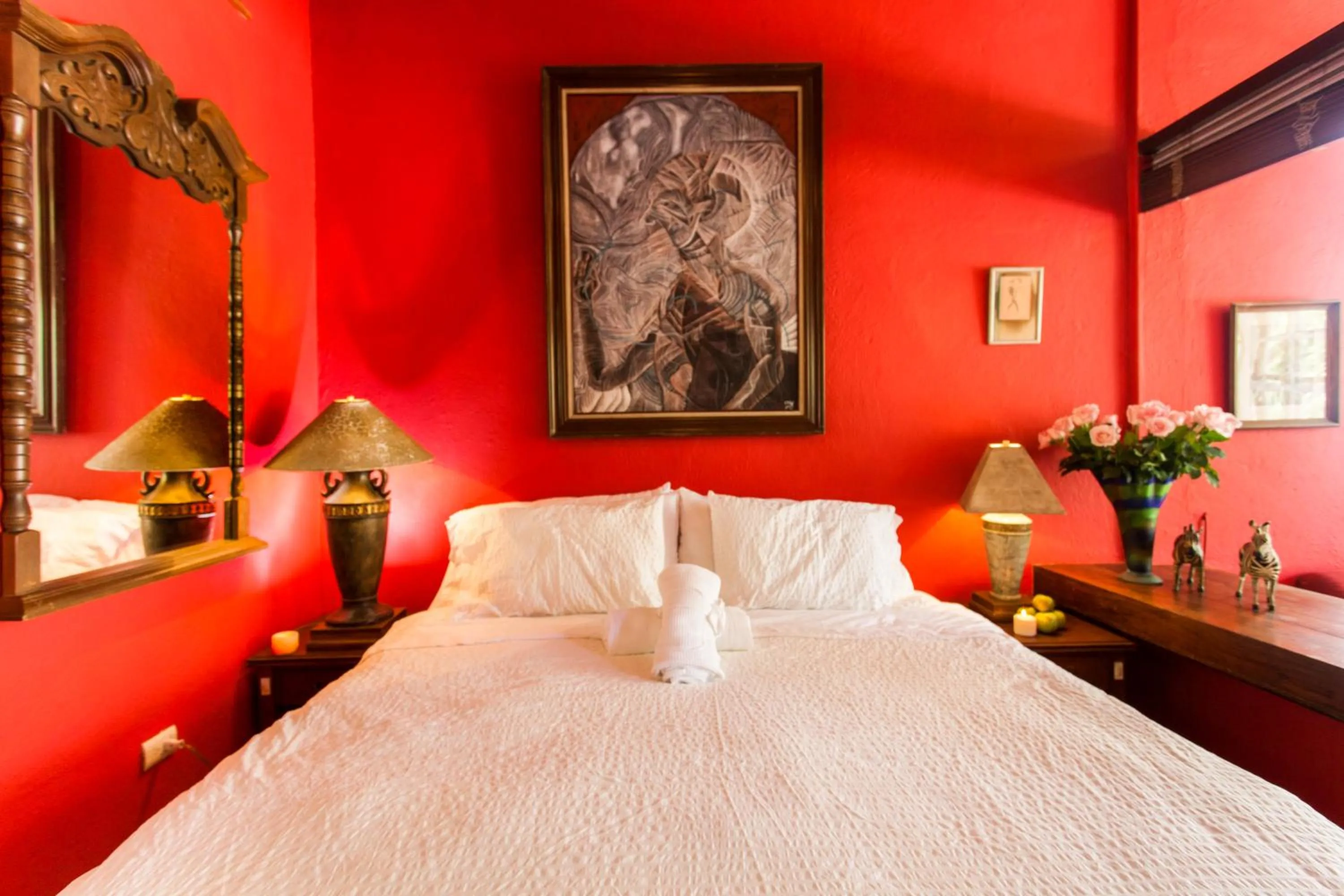 Bed in Garlands Del Rio Riverside Boutique Hotel