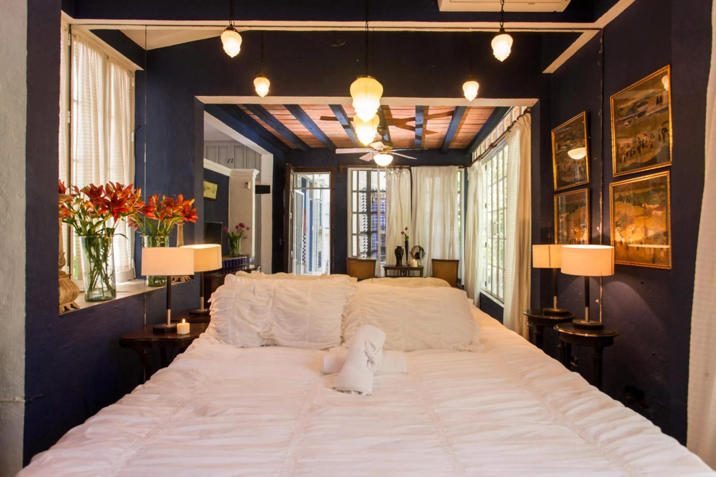 Photo of the whole room, Bed in Garlands Del Rio Riverside Boutique Hotel