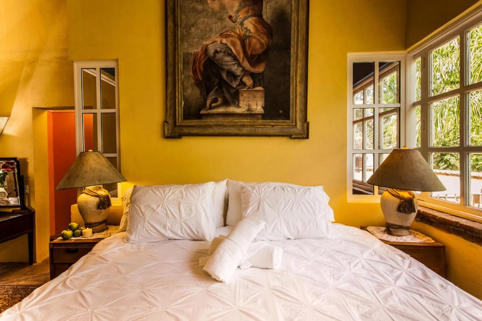 Bed in Garlands Del Rio Riverside Boutique Hotel