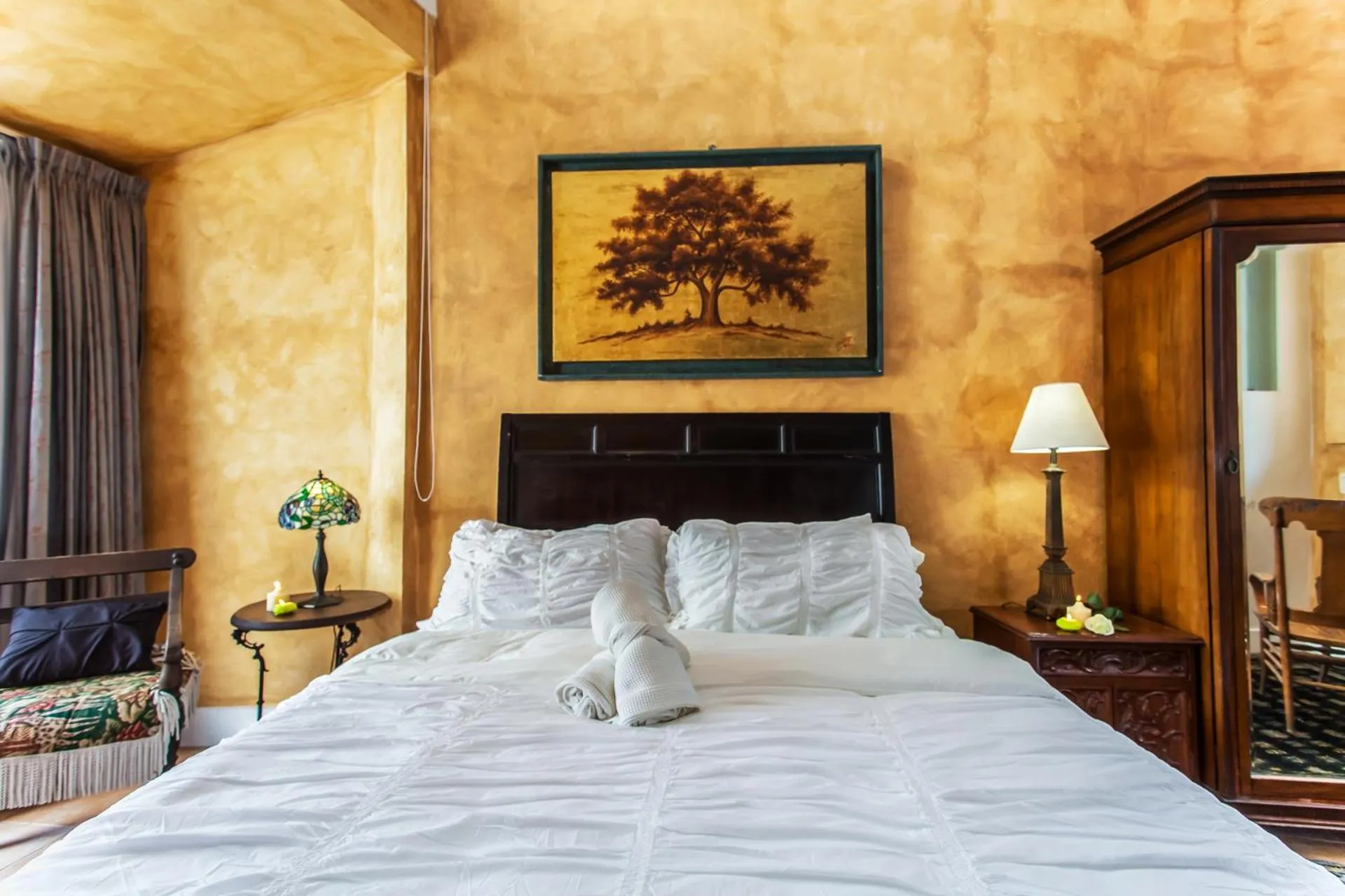 Photo of the whole room, Bed in Garlands Del Rio Riverside Boutique Hotel