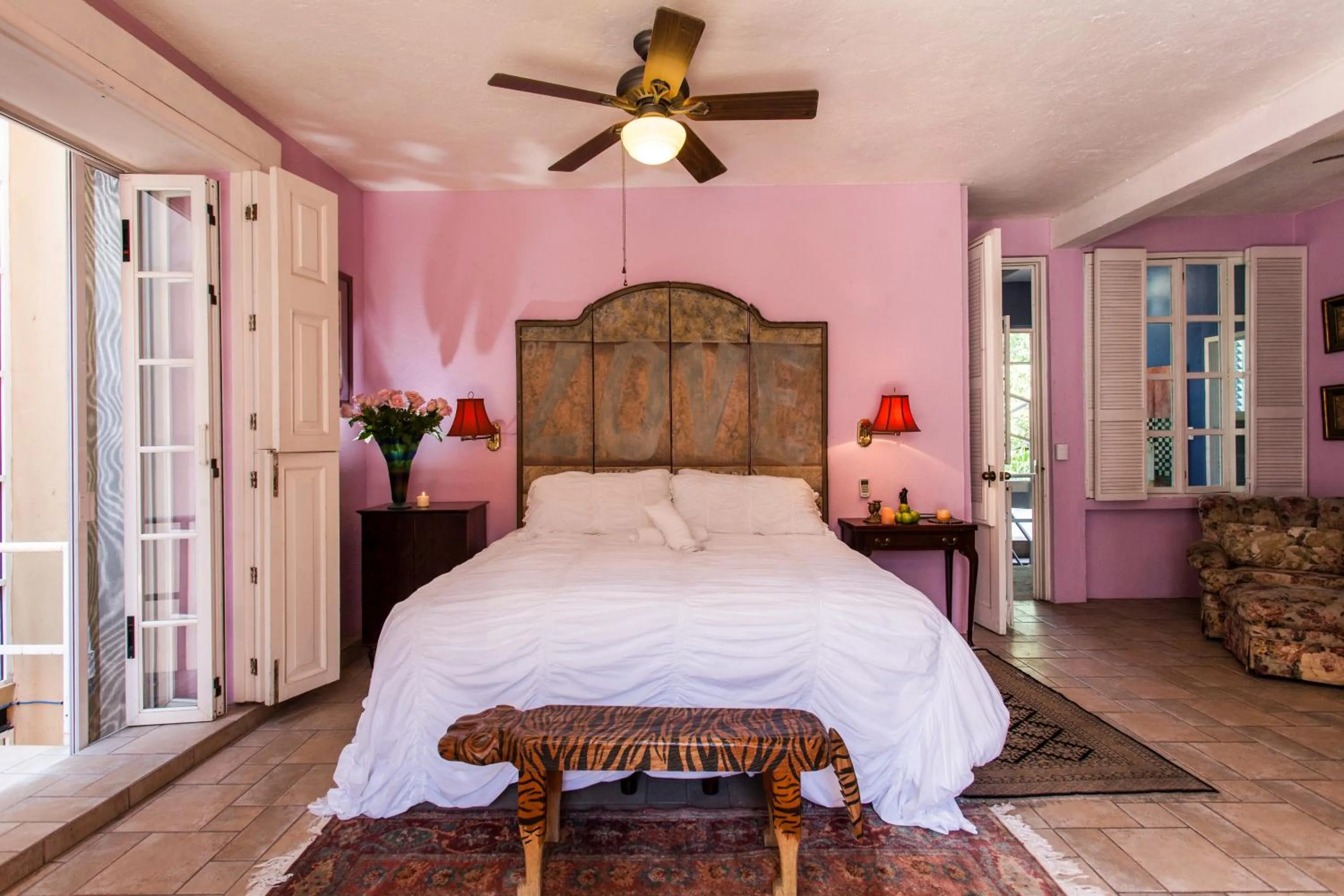 Bed in Garlands Del Rio Riverside Boutique Hotel
