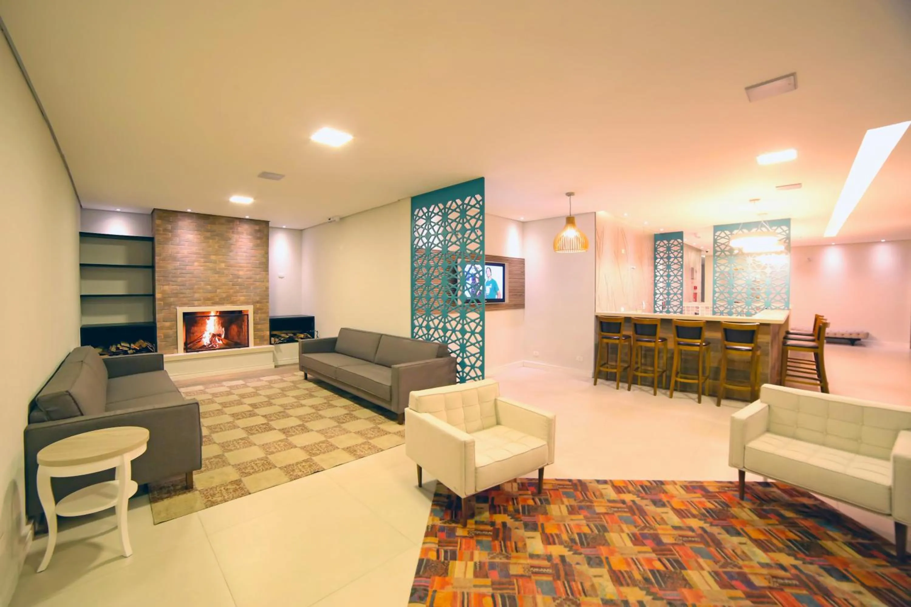 Communal lounge/ TV room in Moinho Itália Hotel